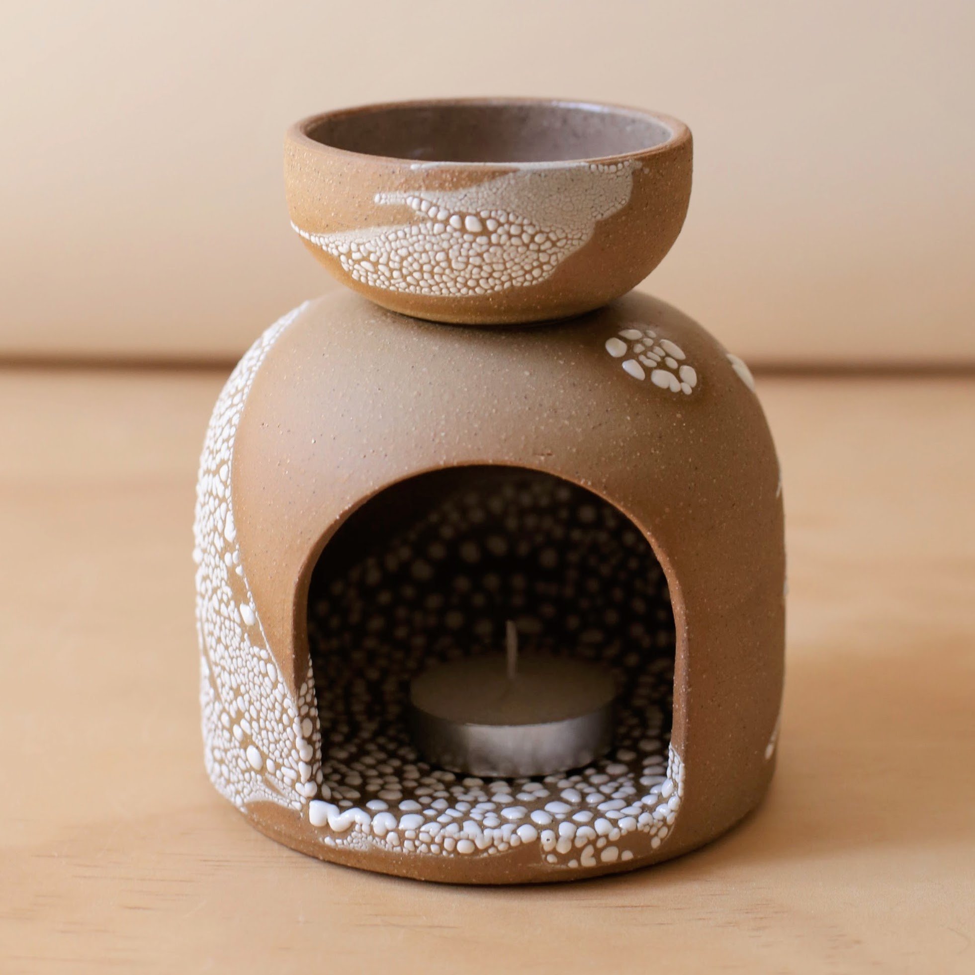 Ceramic oil burner in earthy brown clay