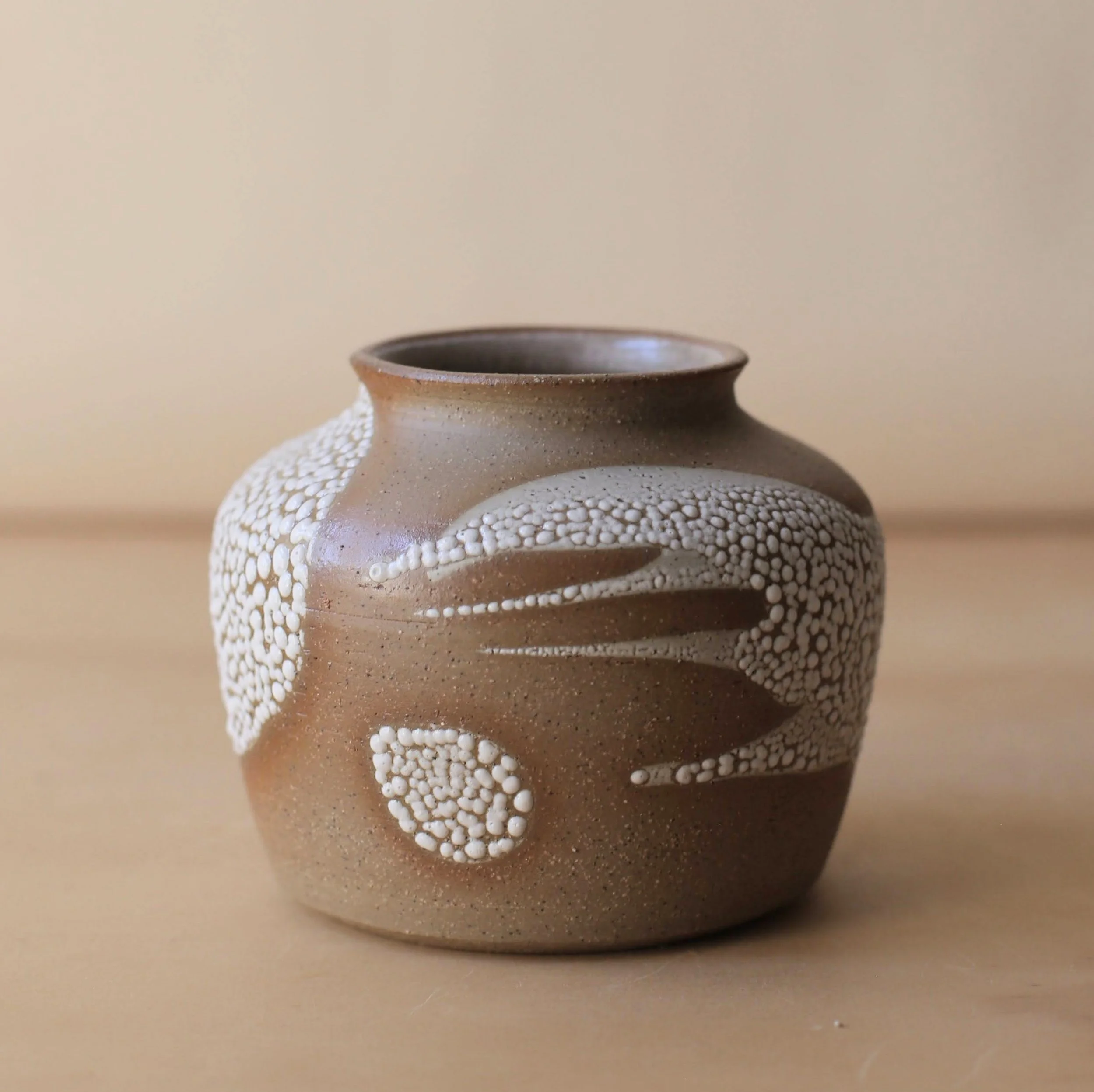 Earthy brown ceramic curve vase