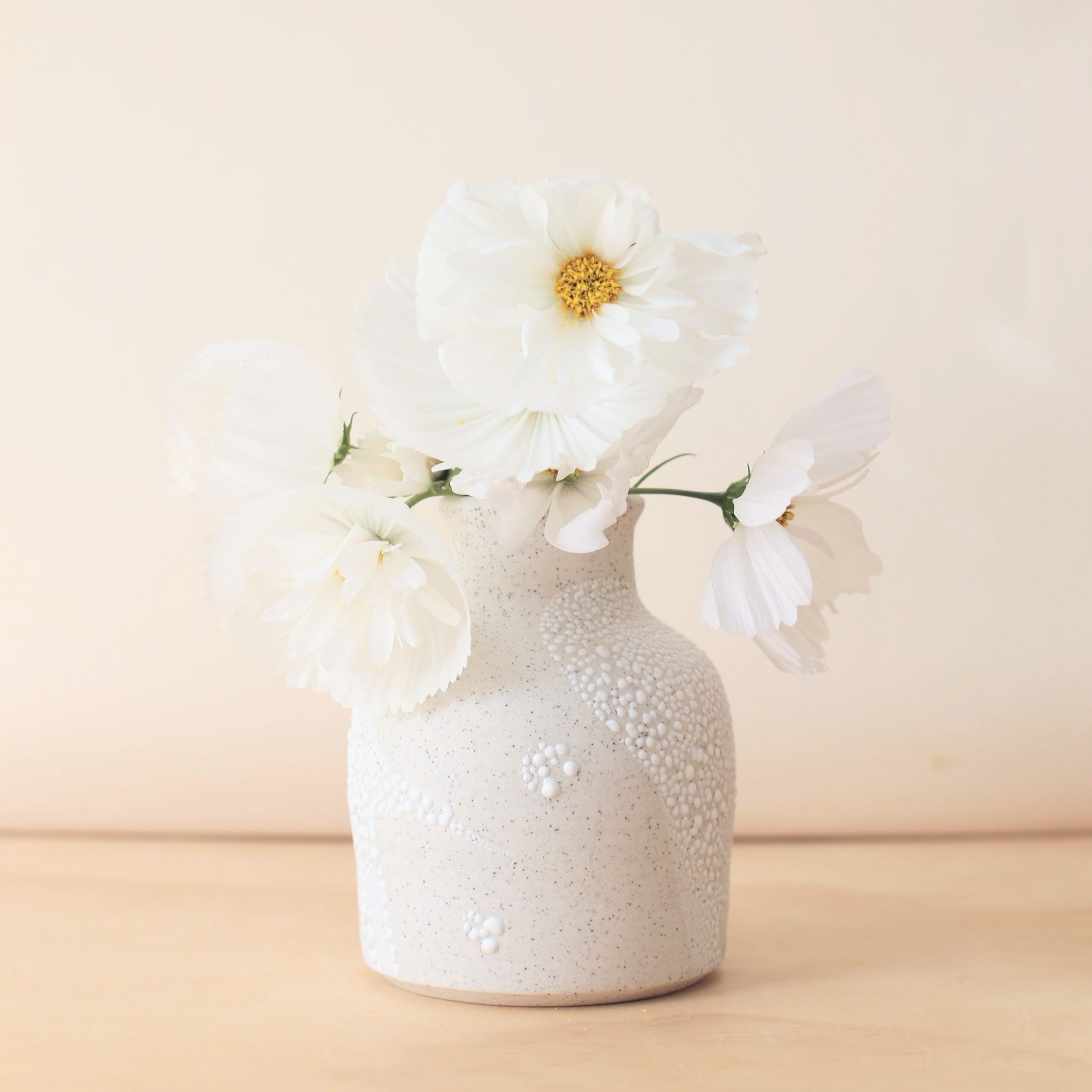 Speckly white ceramic curve vase