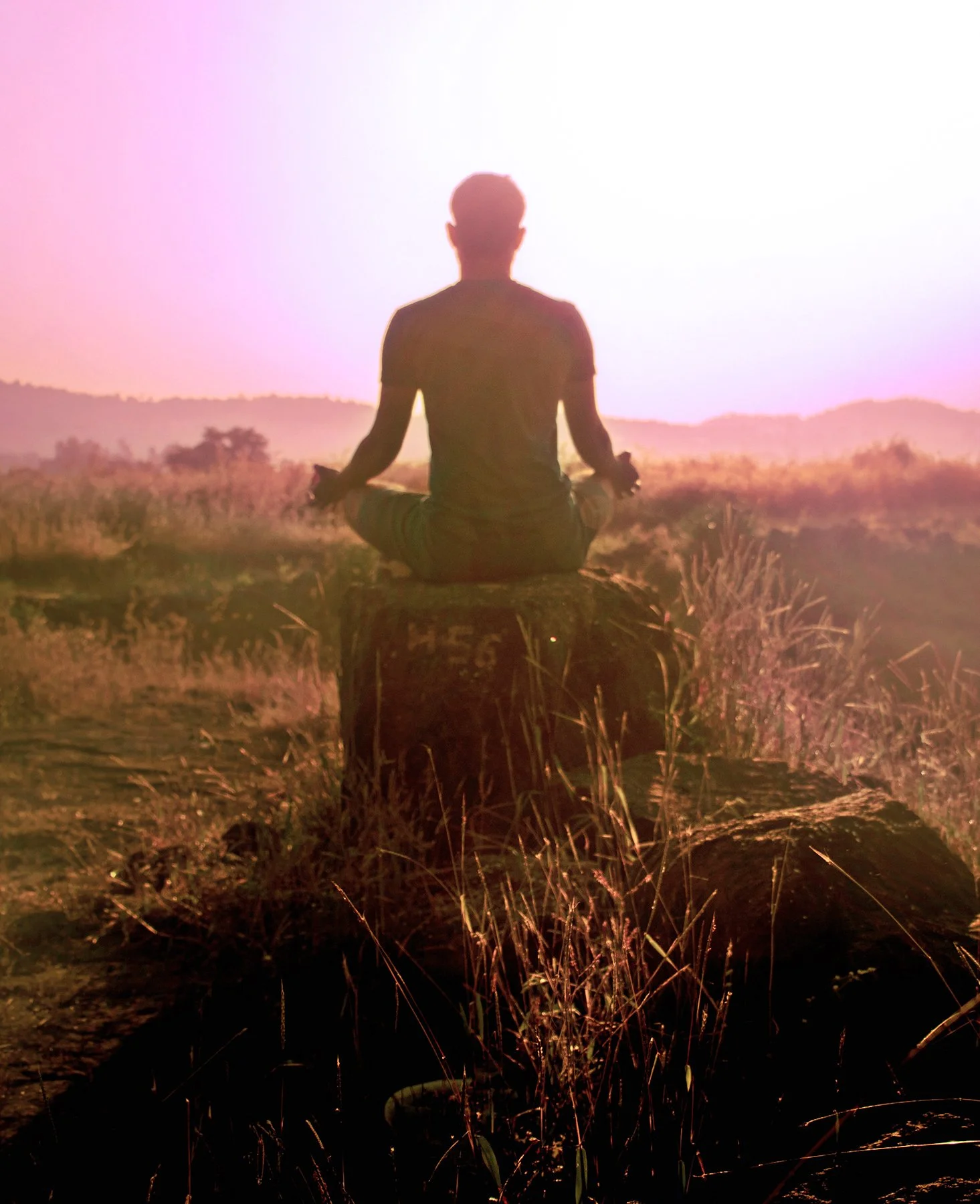 Man meditating outdoors