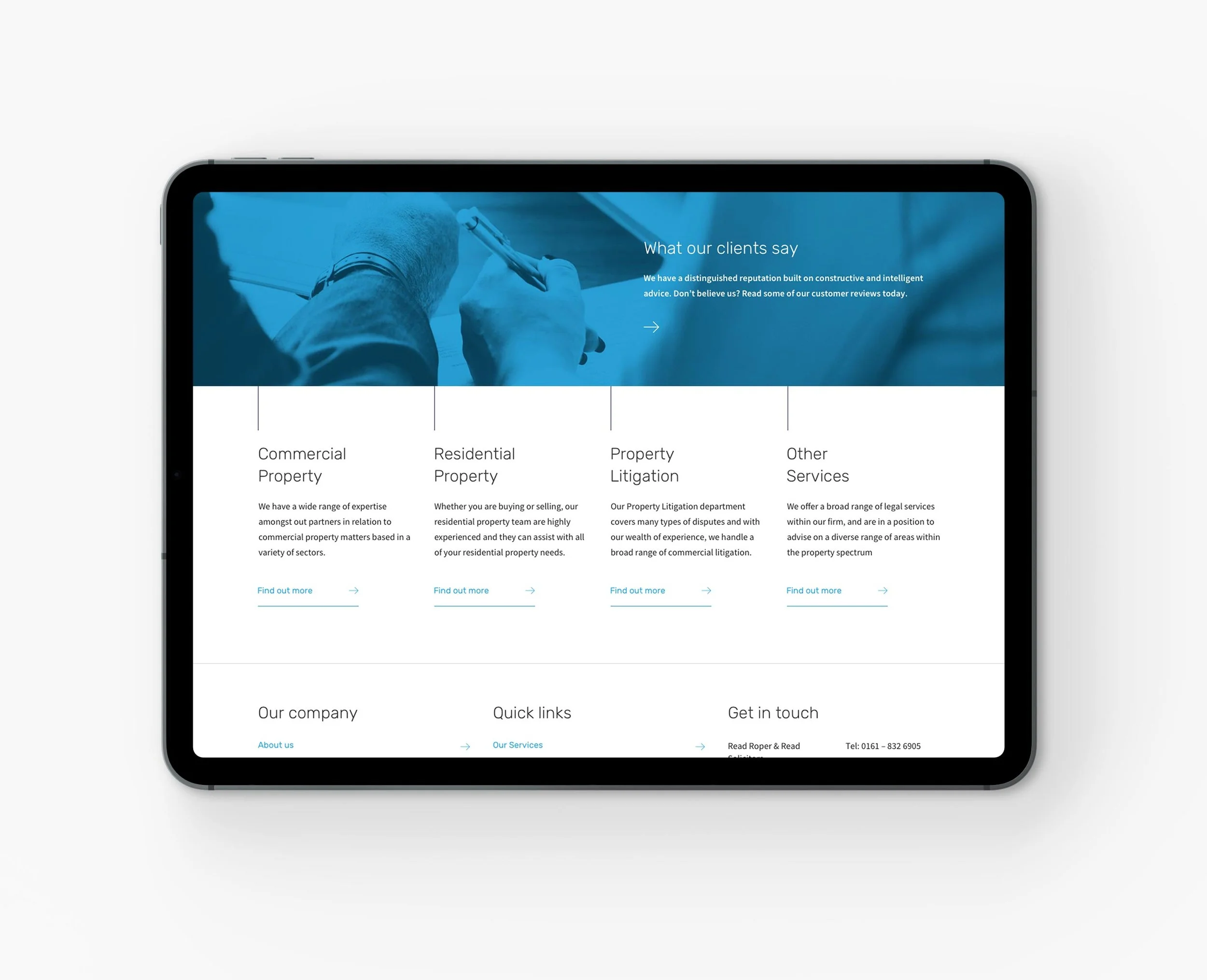 Close-up of a digital tablet displaying a website about property legal services, with sections for commercial, residential, property litigation, and other services, on a white surface.