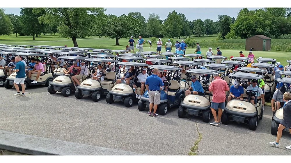 A group of golf carts at the Tony Etchison Memorial Foundation golf outing