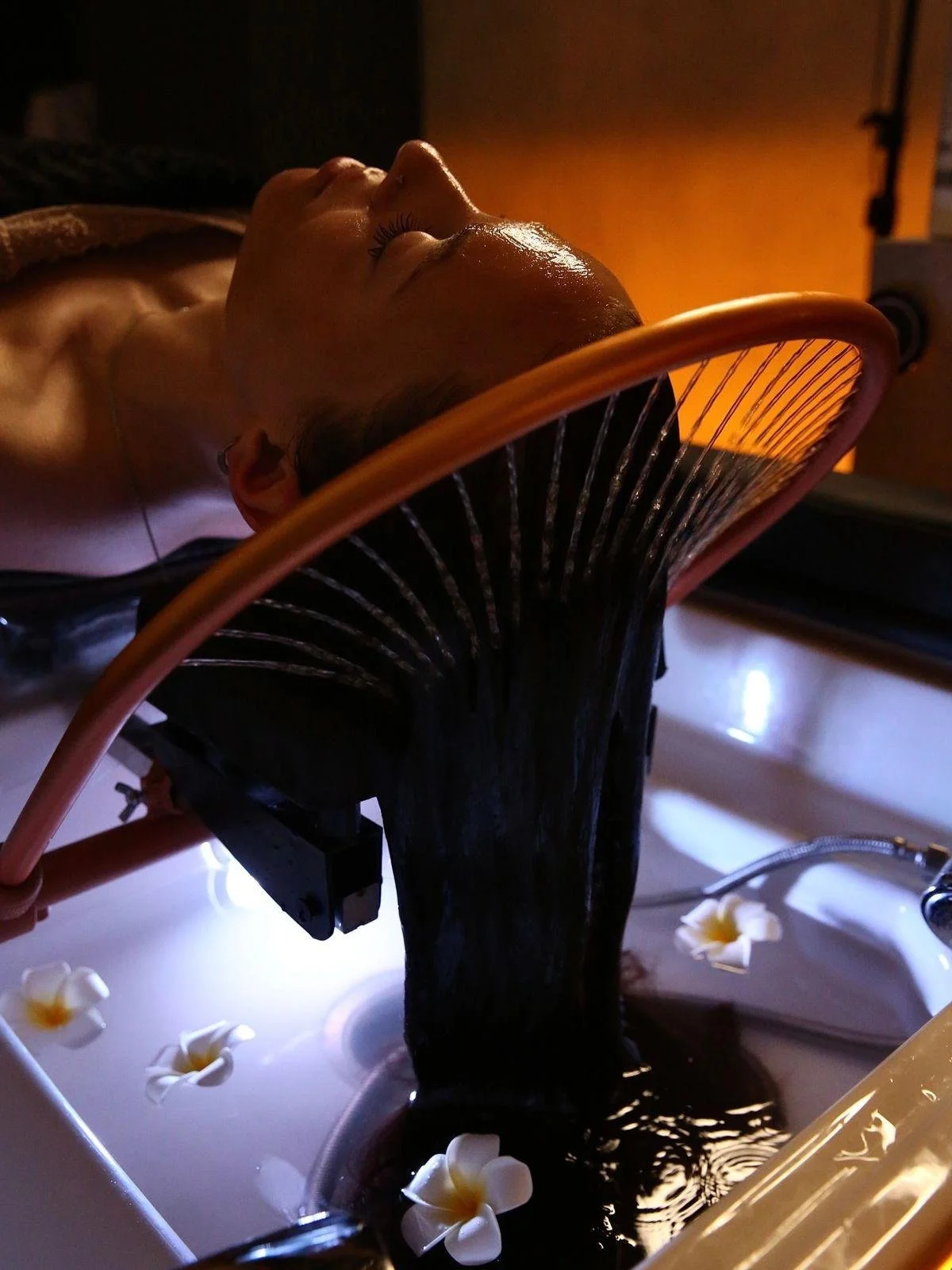 Client receiving a Japanese Head Spa treatment at Calma Head Spa in Watford, designed to promote relaxation, scalp health, and wellbeing.