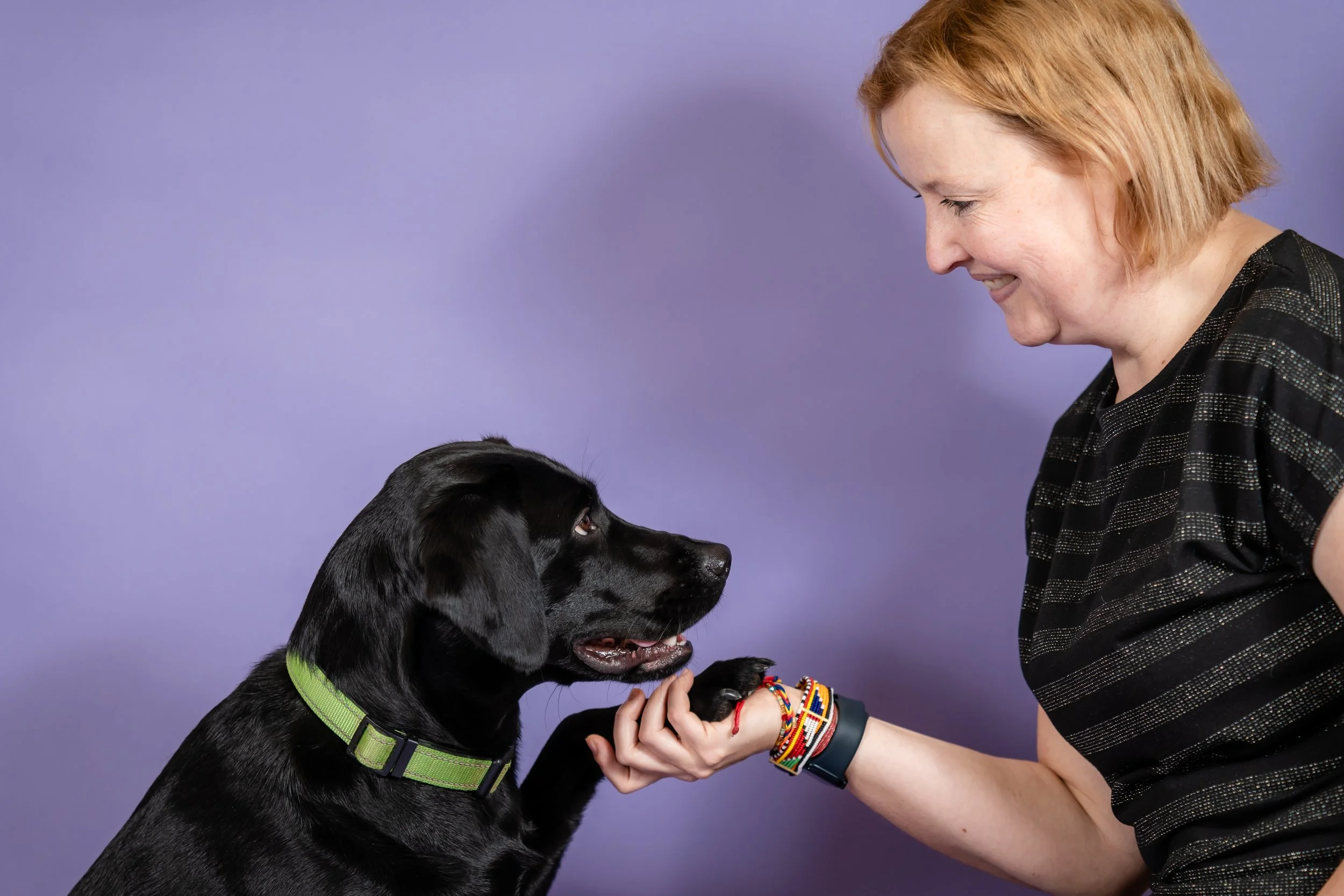 Charlie, a PIP support specialist, with her assistance dog helping people with PIP claims in the UK