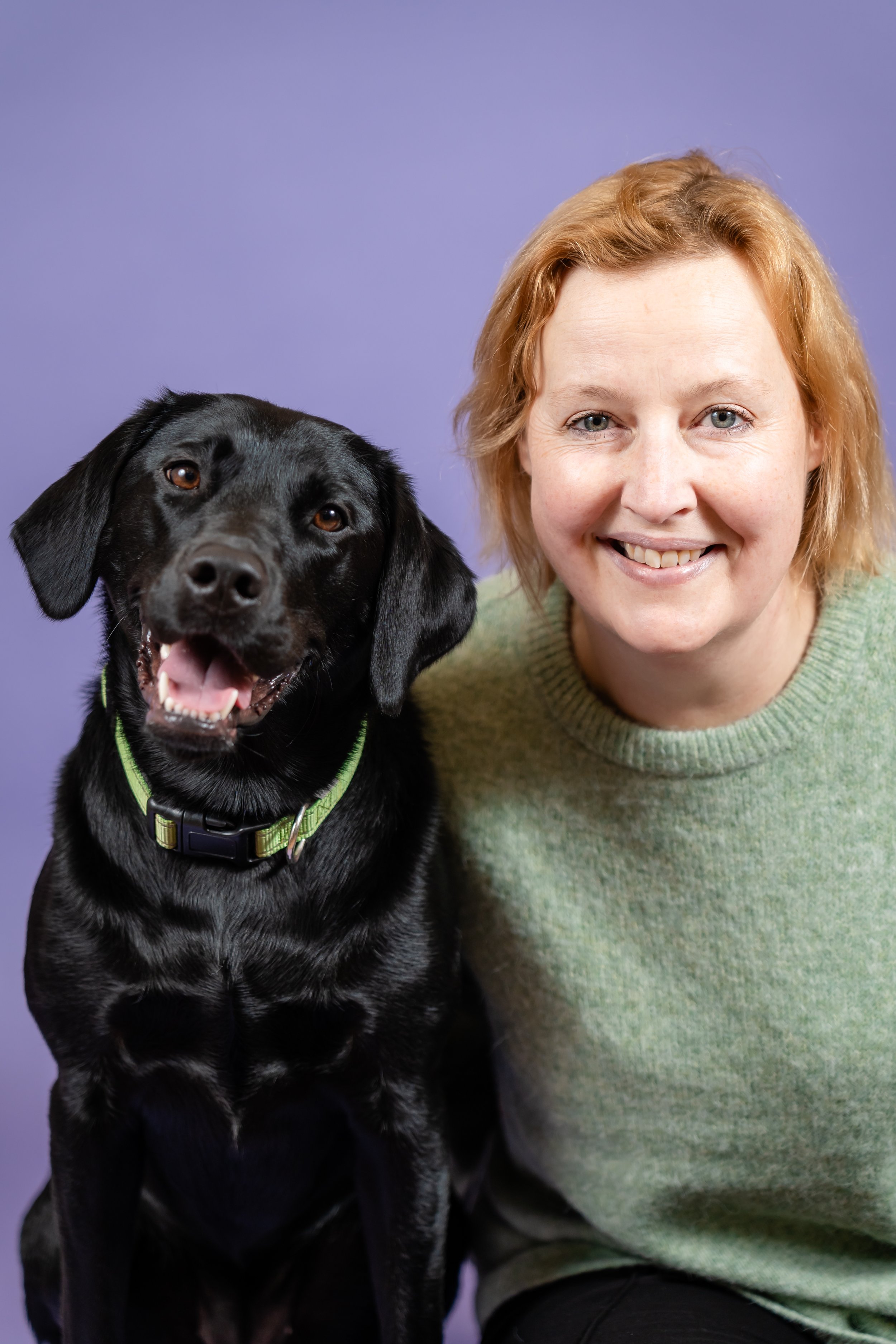 Charlie with her dog offering support and guidance for people navigating PIP in the UK