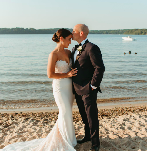 Wedding couple kissing on the beach