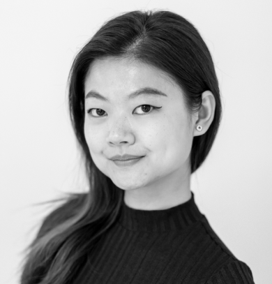 Black and white portrait of Sejin Paik with straight dark hair, wearing a dark sweater and small earrings, smiling subtly.