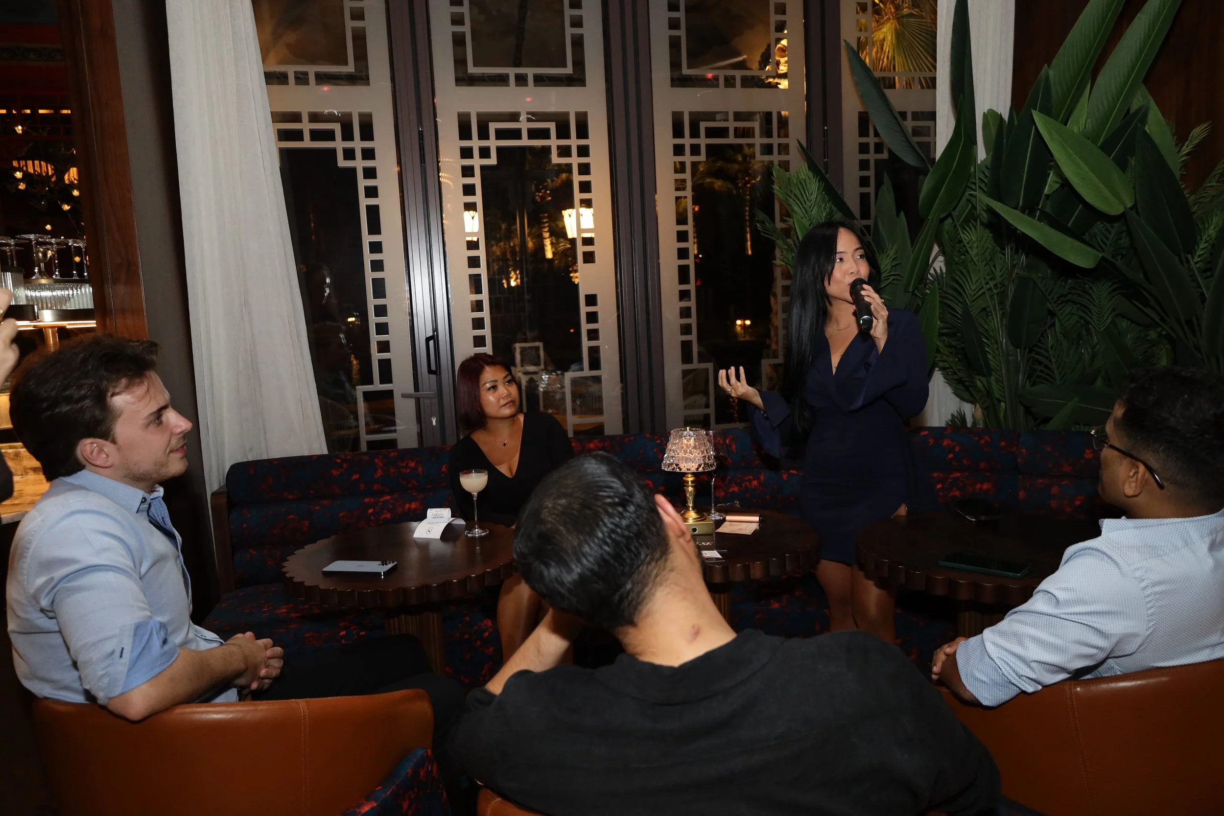 Two people at Reinv8nt events talking about relocating to Dubai