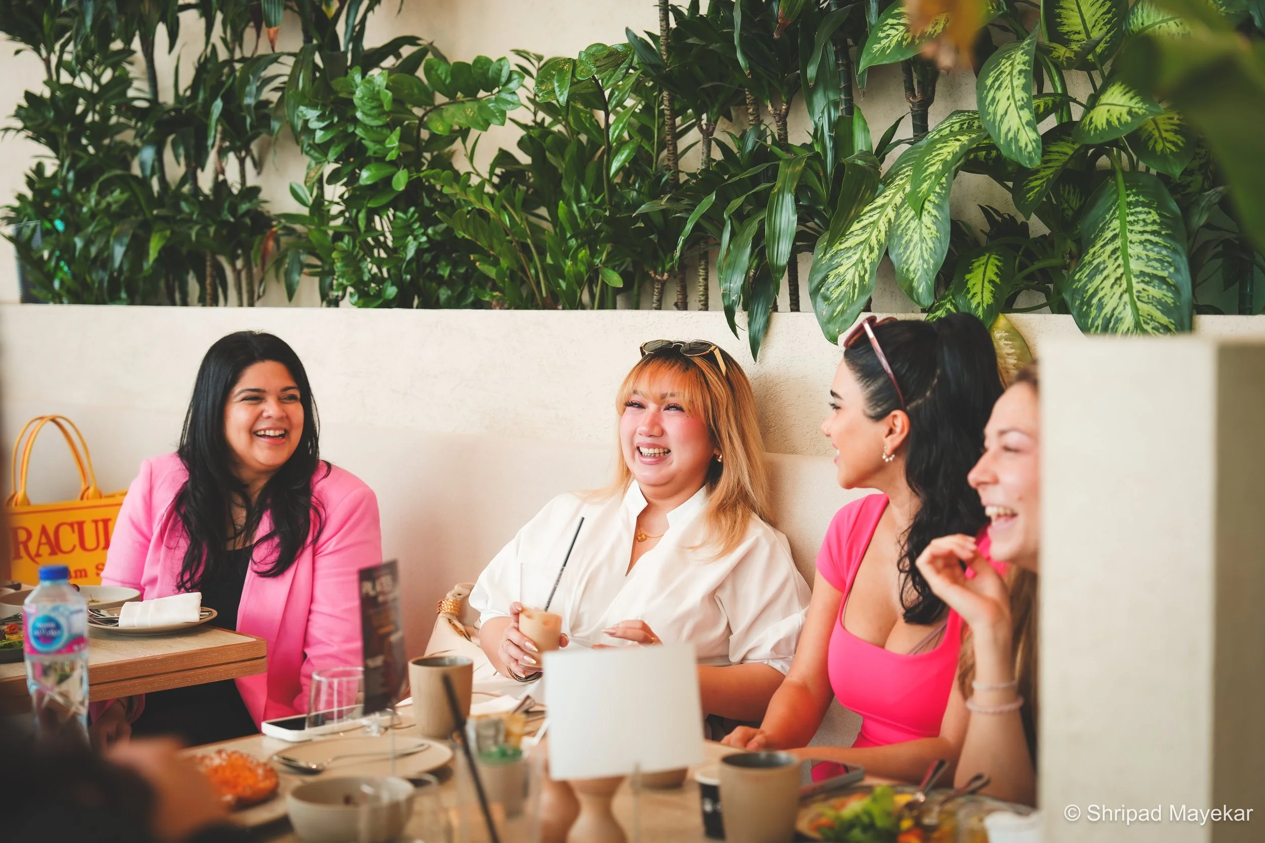 Women connecting and sharing contacts at a REINV8NT SHE Builds, Dubai. A networking event for founders, entrepreneurs, and professionals in Dubai scheduled for November 14th from 10 am to 12 pm at a location with 80 seats.