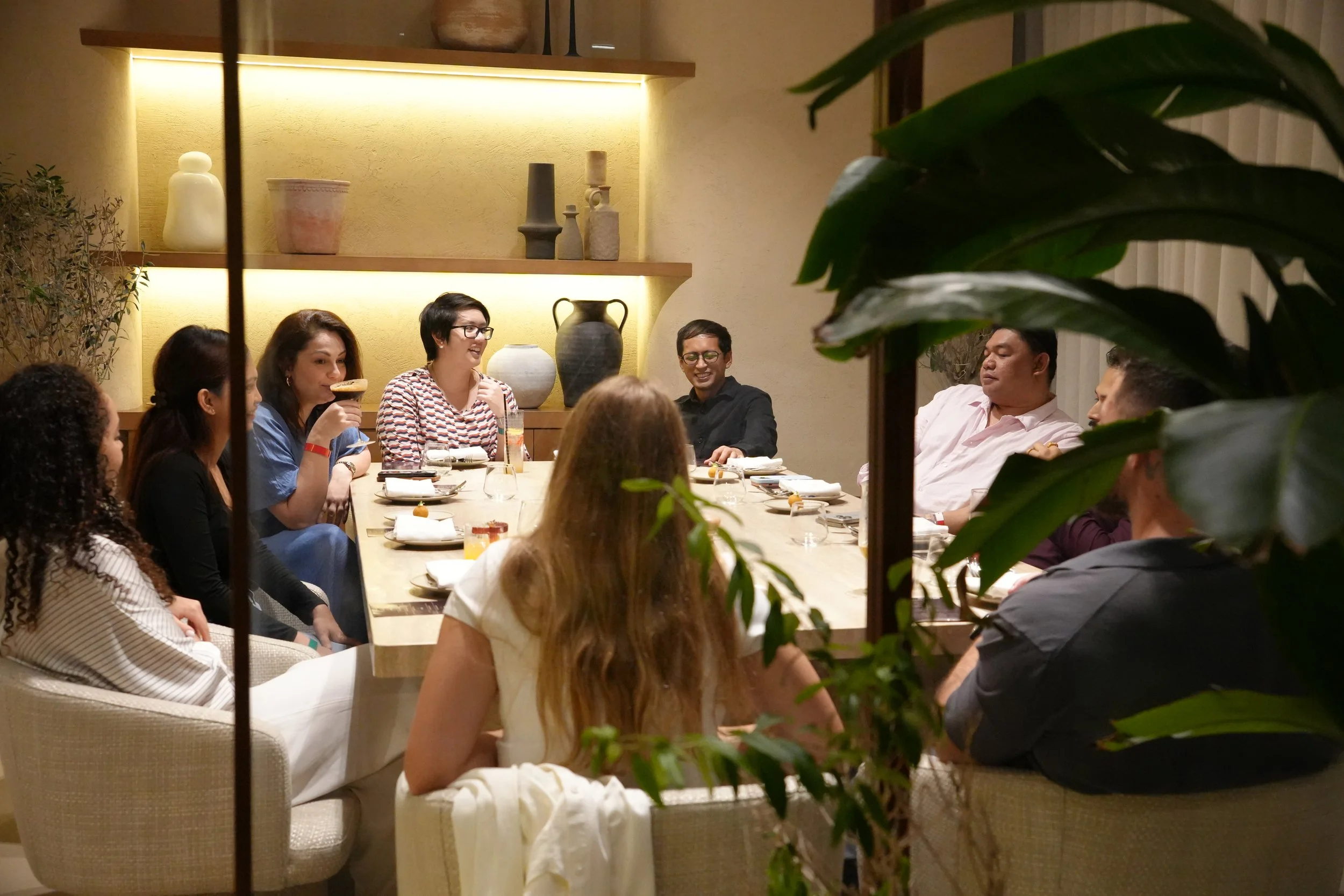 Guests at a REINV8NT Social Night curated dinner in Dubai. Next Social night is with a vision board activity scheduled for October 17 & 18.