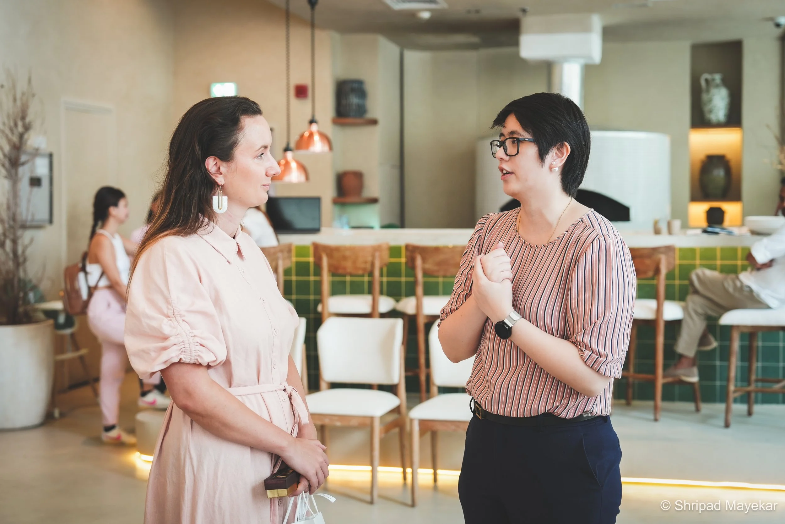 Professionals in conversation at a REINV8NT networking evening in Dubai