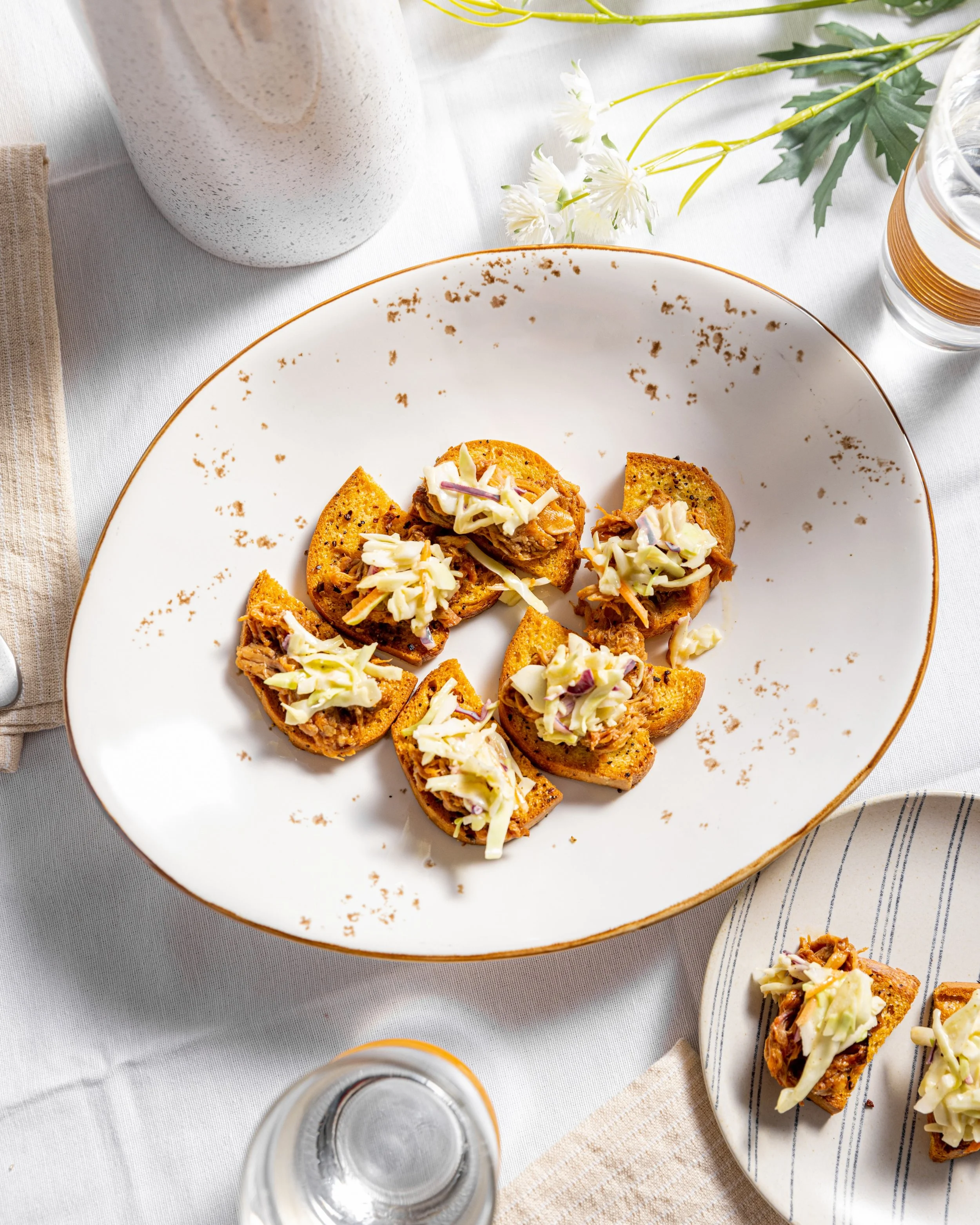 Small bite, big flavor. Our BBQ Pulled Pork Crostini is one of our favorite hand-passed hors d&rsquo;oeuvres, featuring smoked BBQ pulled pork topped with Mardi Gras slaw for the perfect mix of savory, smoky, and bright.

It&rsquo;s an easy crowd-ple