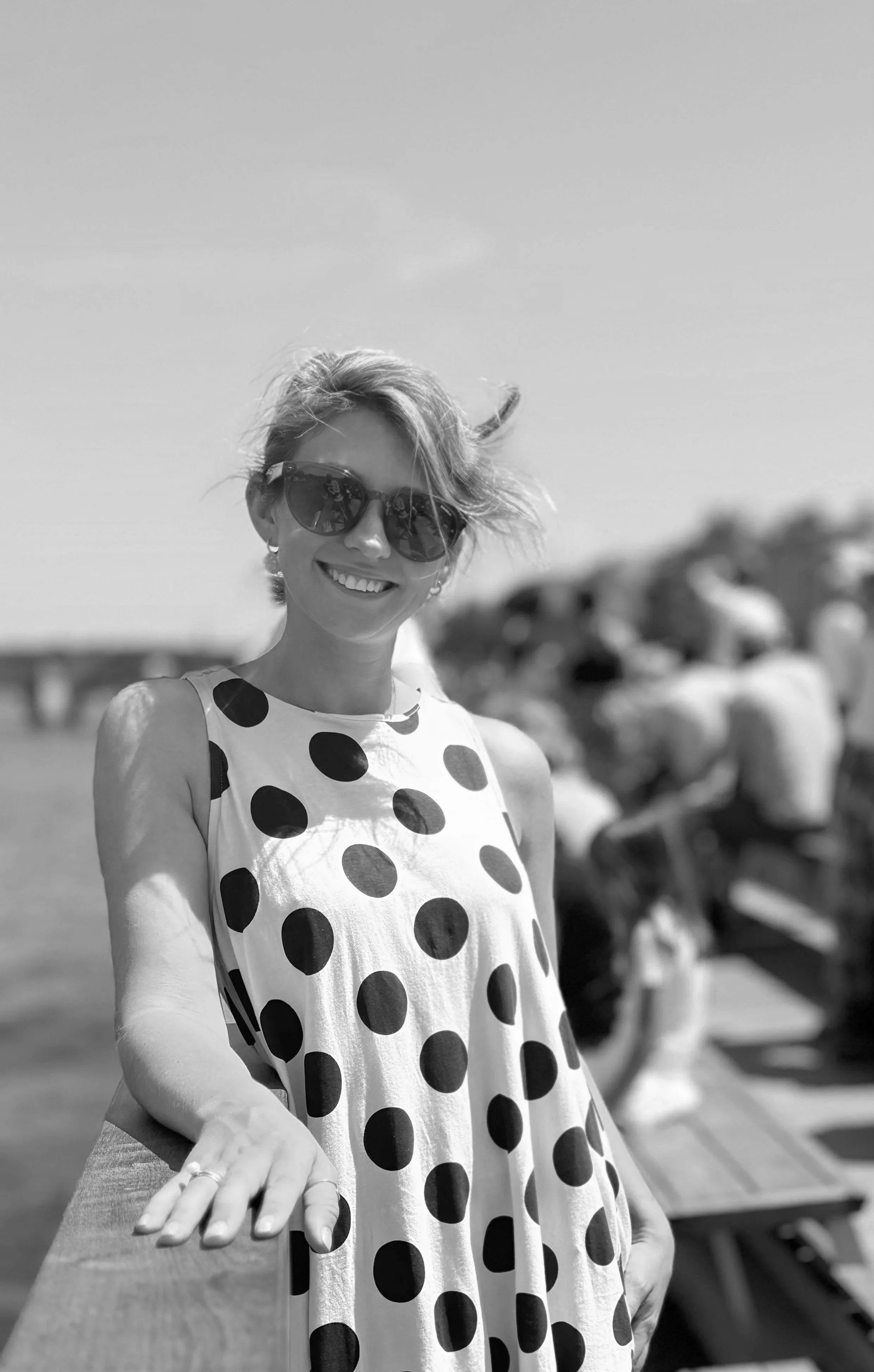 I women in a dotted dress pictured outside