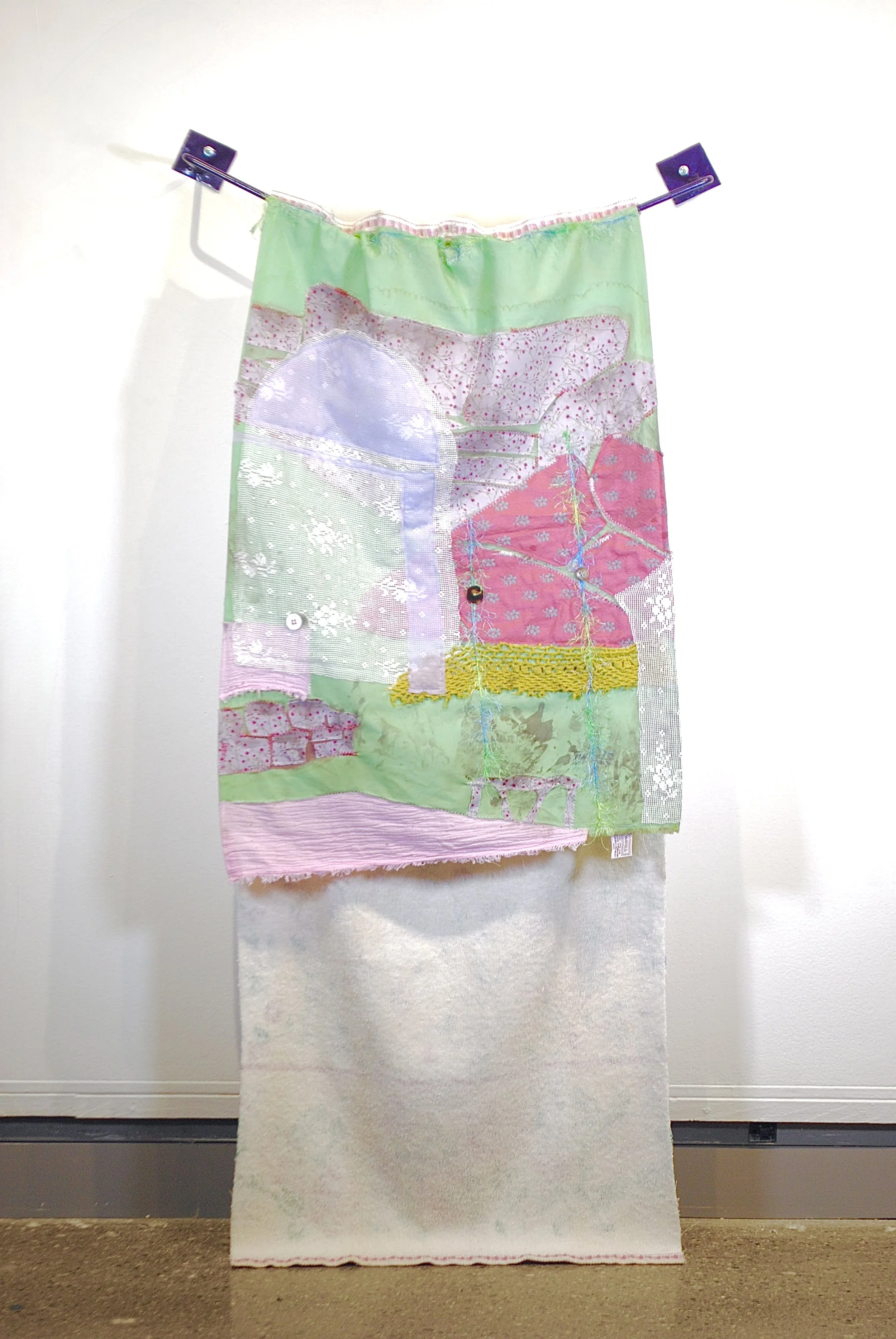 Tea Towel, 2026
Mixed fabrics, thread, yarn, buttons, coffee, acrylic paint, towel rod
24” x 48”
