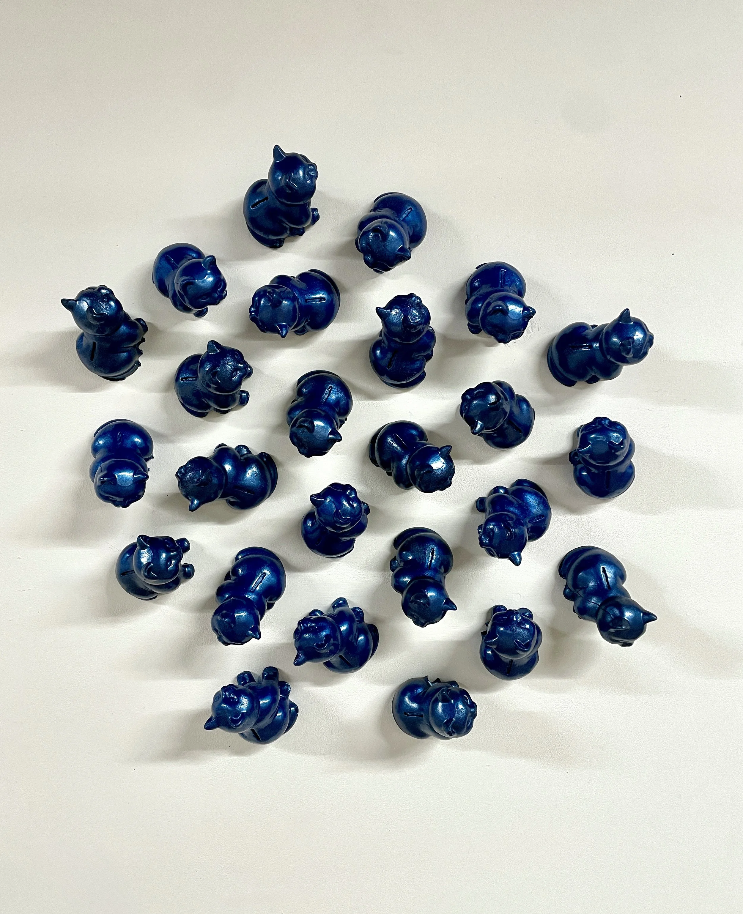 Traffic jam!, 2024
25 polyurethane foam cats, cobalt blue spray paint
36” x 36”