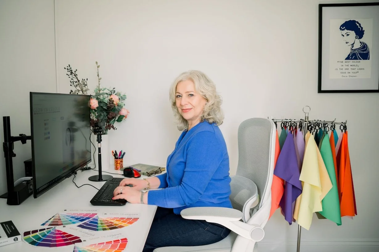 Woman sitting at desk during styling session