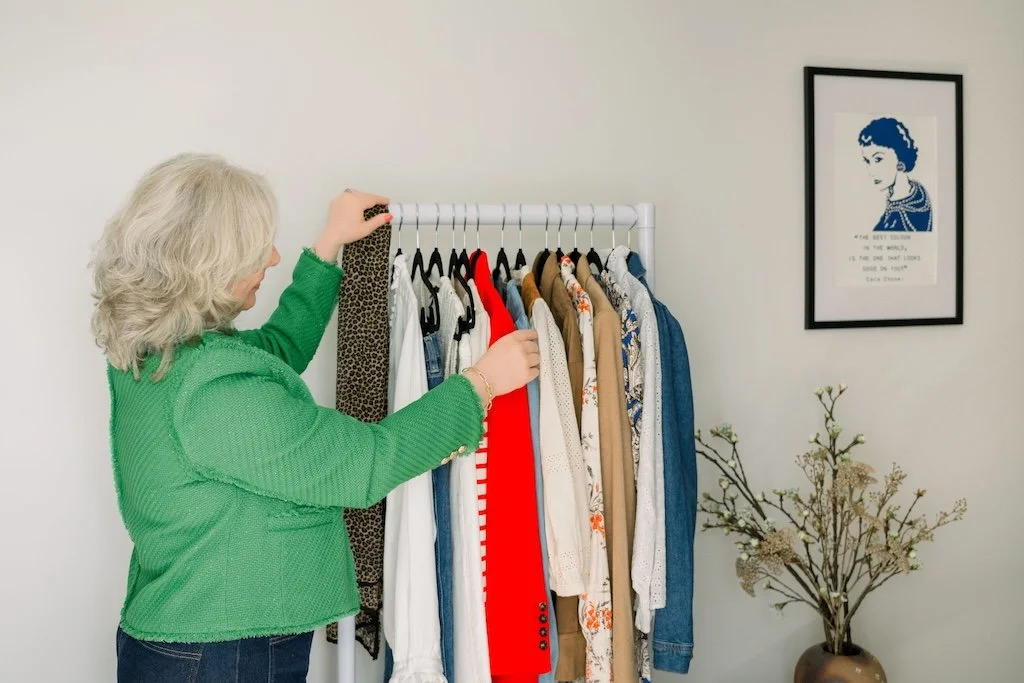 Personal stylist working with clothing rail during a styling session