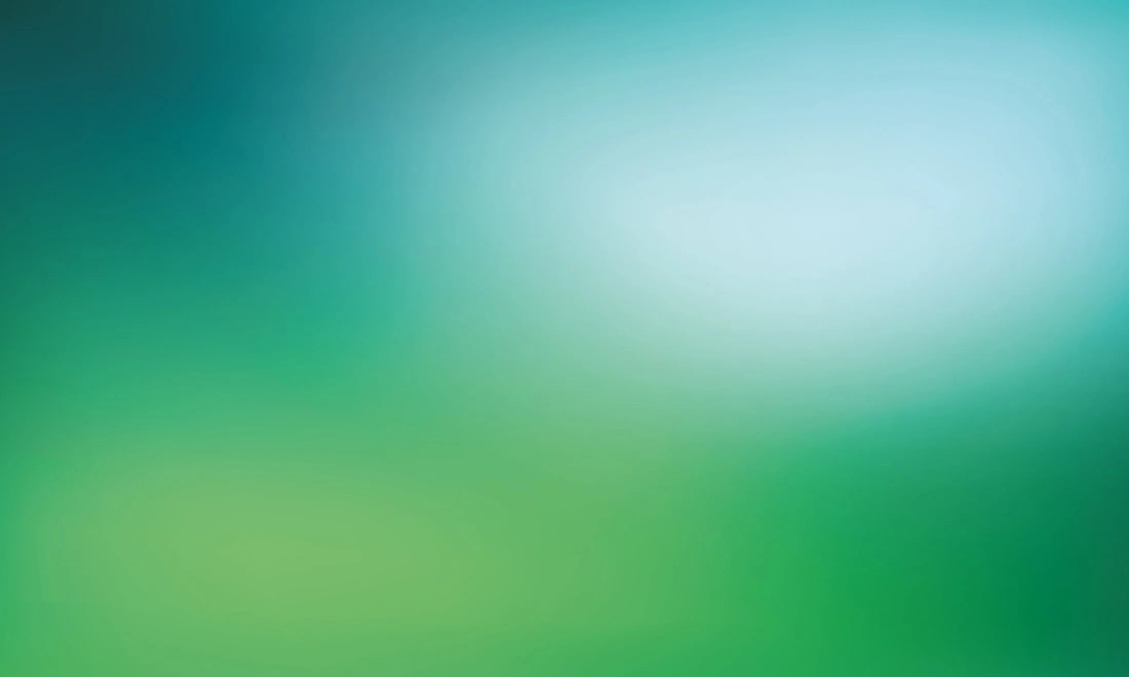 Blurred background with gradient shades of blue and green.