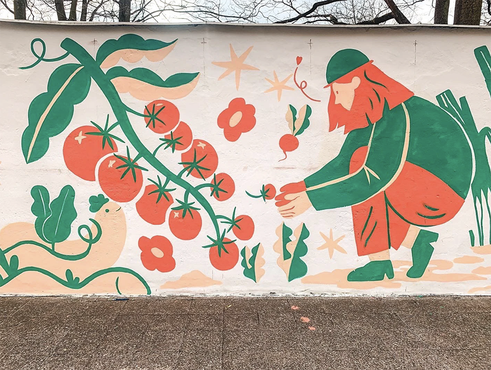 mural painting of tomatoes and a woman harvesting them