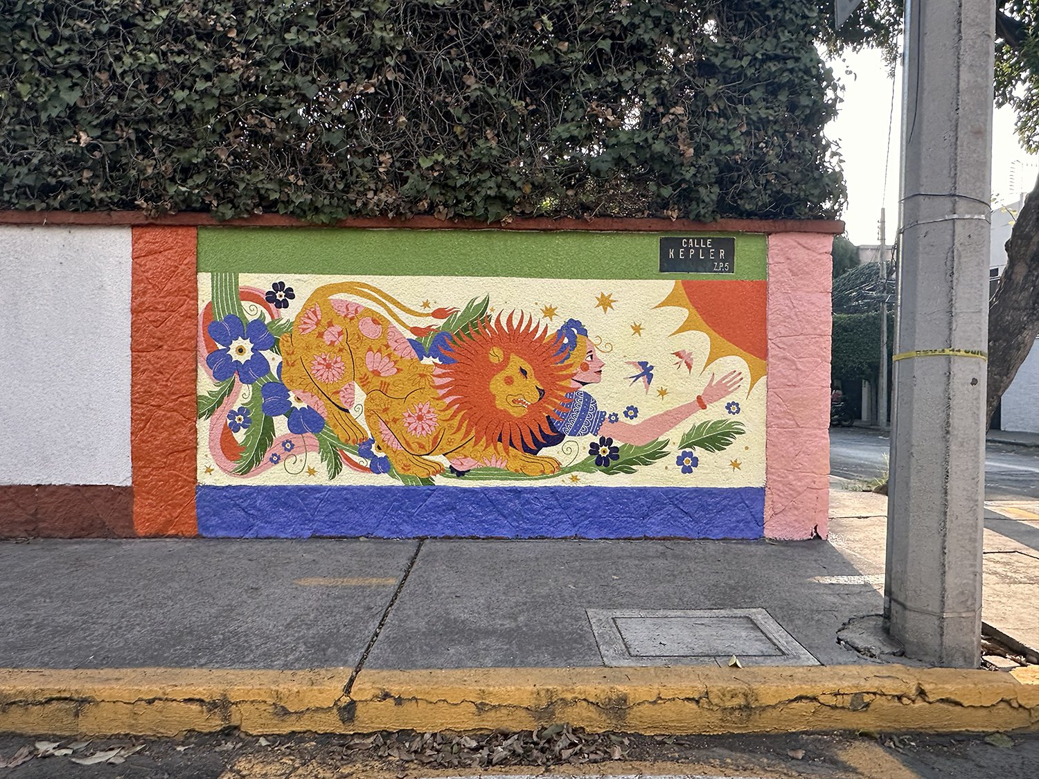 mexican mural a lion with czech folklore patterns and a woman in a traditional dress surrounded by flowers