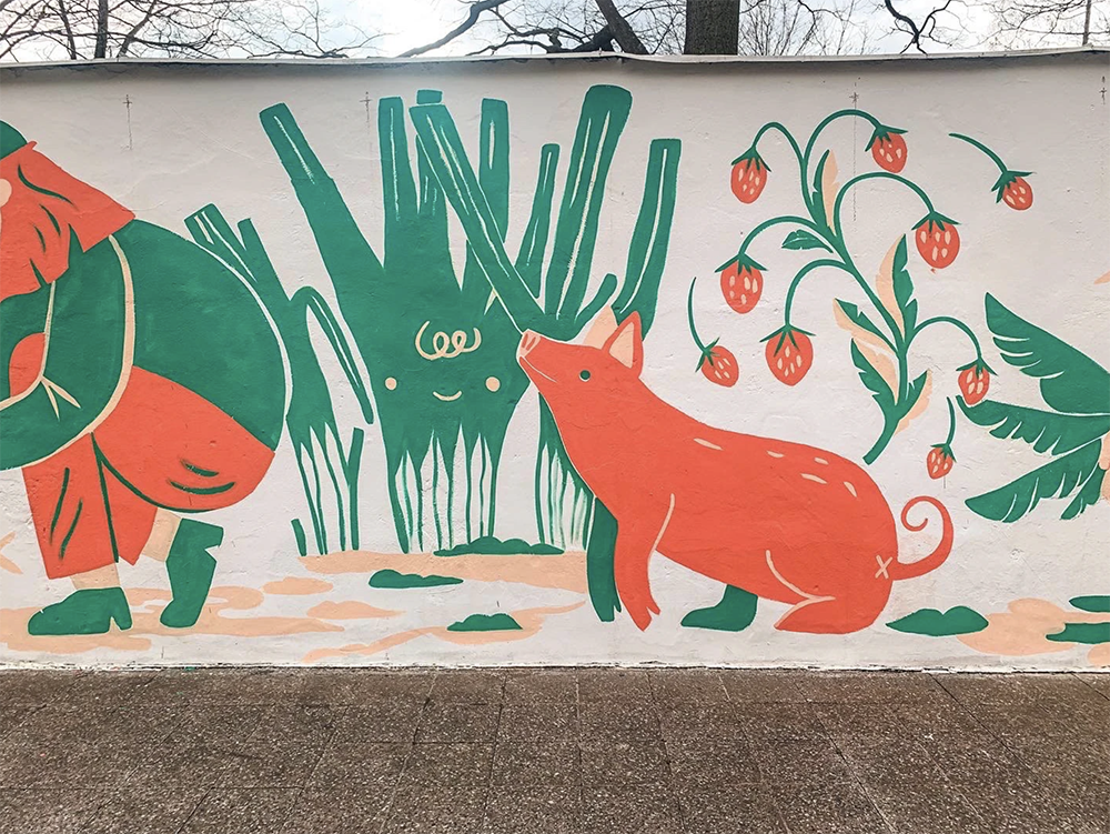 mural painting of a cute pig with vegetables and strawberries