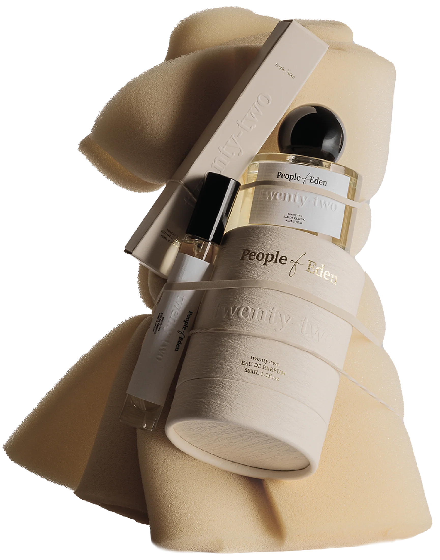 A bottle of People by Eden perfume, a boxed item with the brand name, and two sponge applicators, all arranged on a soft beige background.