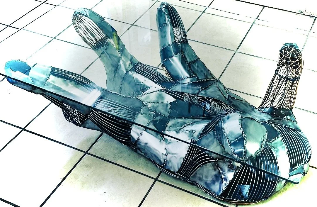 COLLECTED
reversible steel and glass organic robotic alien hand coffee table