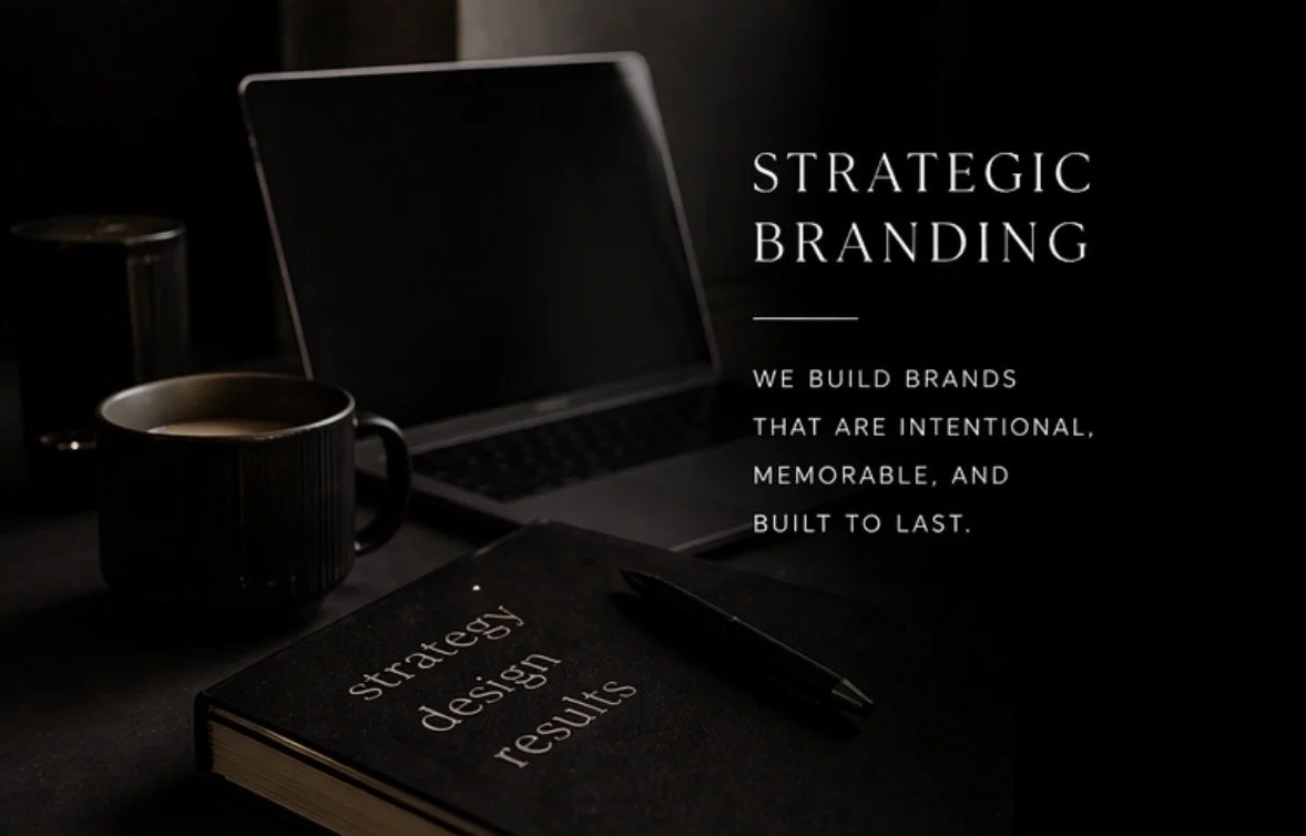 Desk setup with a laptop, a coffee mug, and a black notebook titled 'strategy design results' with a pen on top. The background has a dark ambiance and a quote about strategic branding.