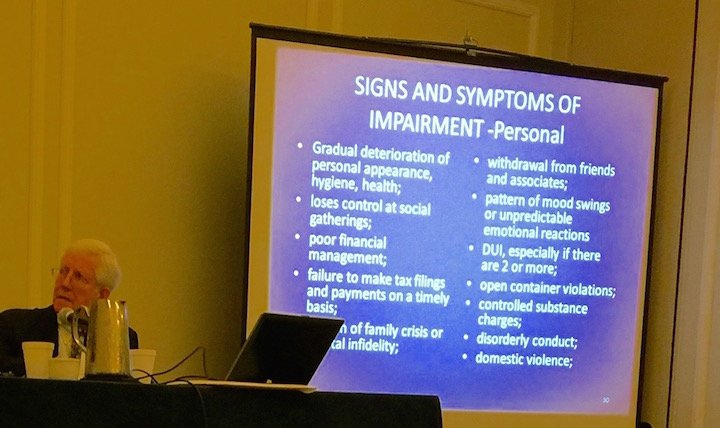 Presentation slide titled 'Signs and Symptoms of Impairment - Personal' listing warning signs including deterioration of appearance and hygiene, social withdrawal, poor financial management, family crisis, mood swings, emotional reactions, DUI, open 