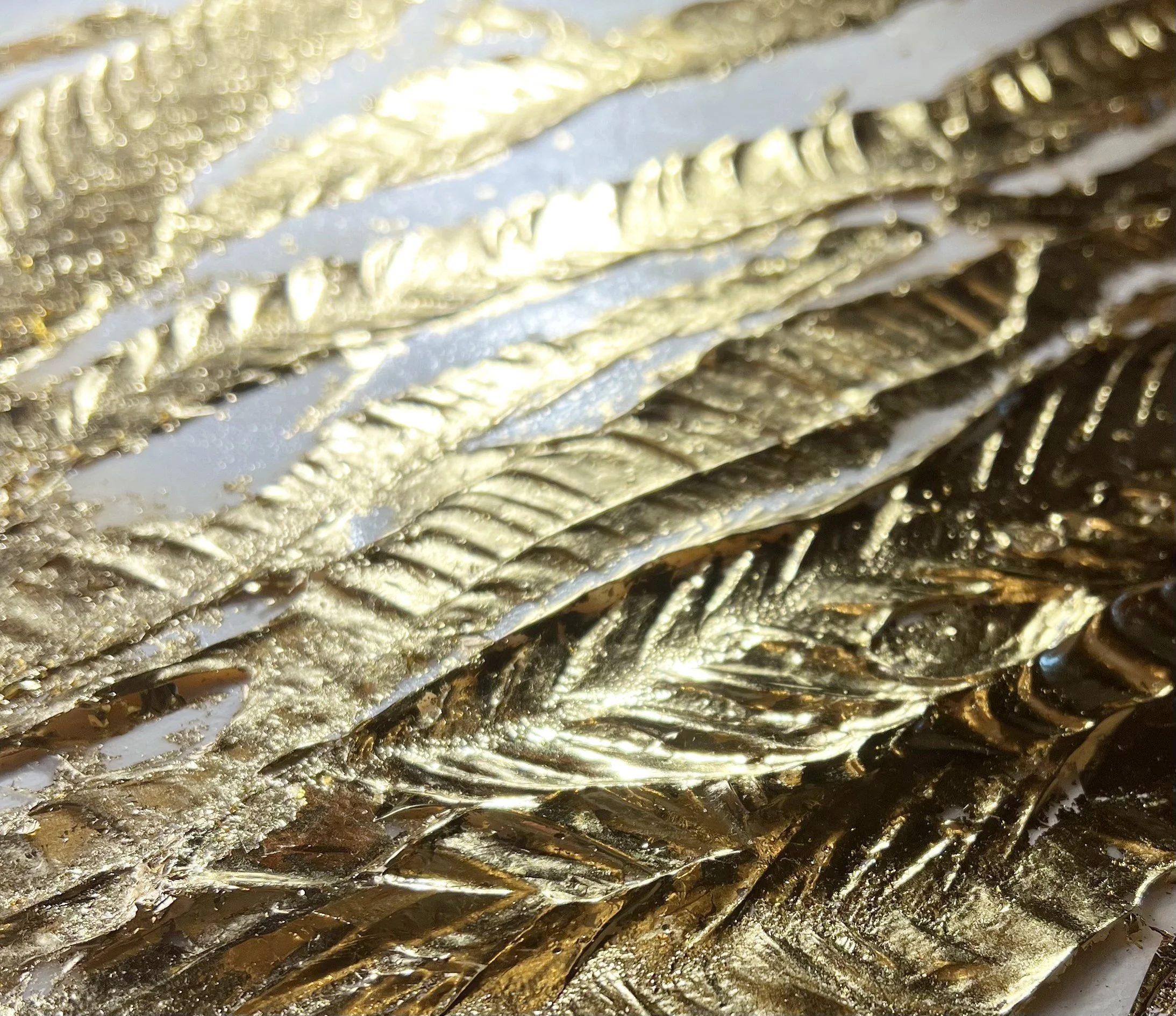 Close-up of an original Auric Art artwork featuring hand-applied gold leaf and rich natural textures.