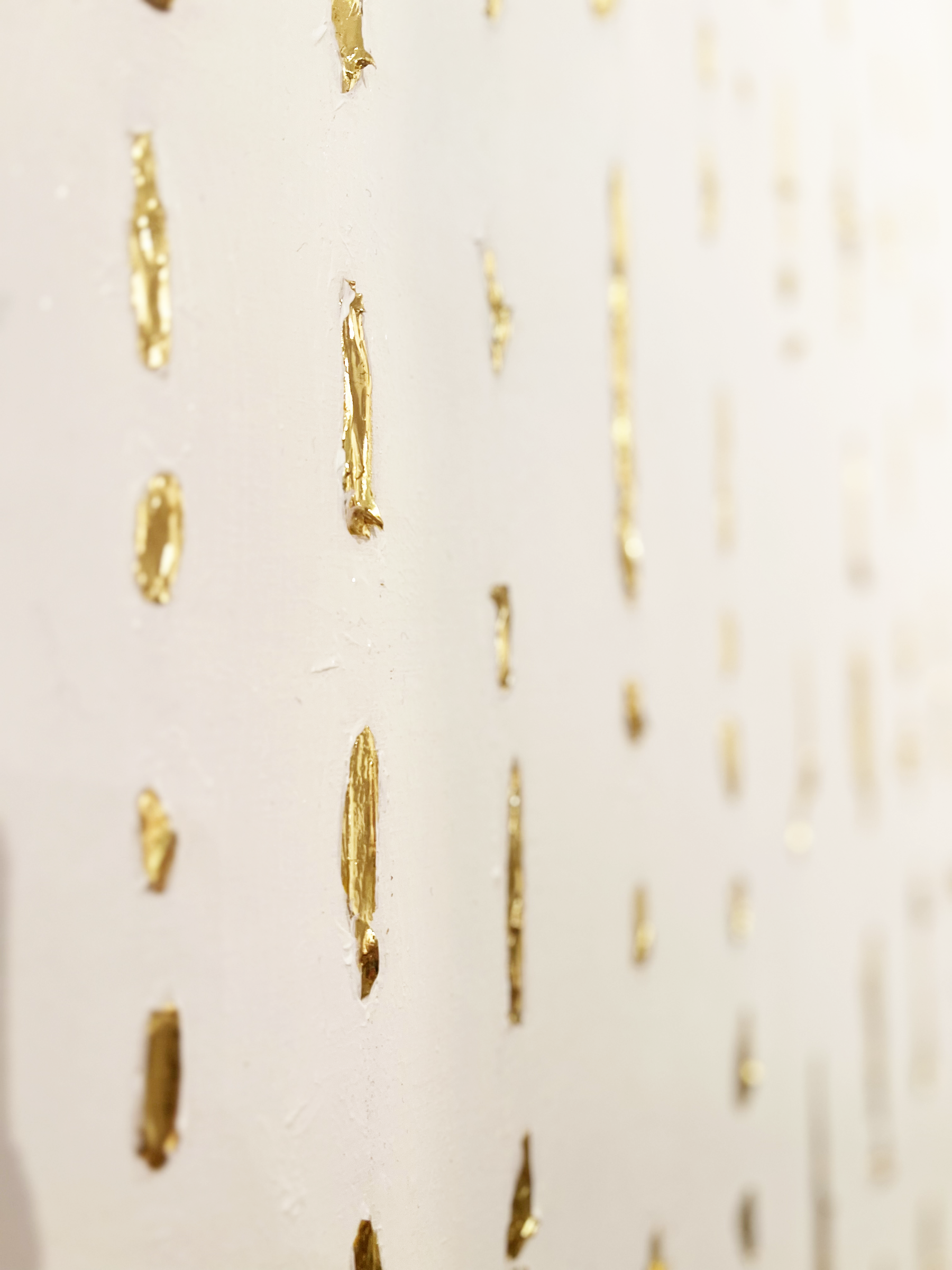 Close-up of an original Auric Art artwork featuring hand-applied gold leaf and rich natural textures.