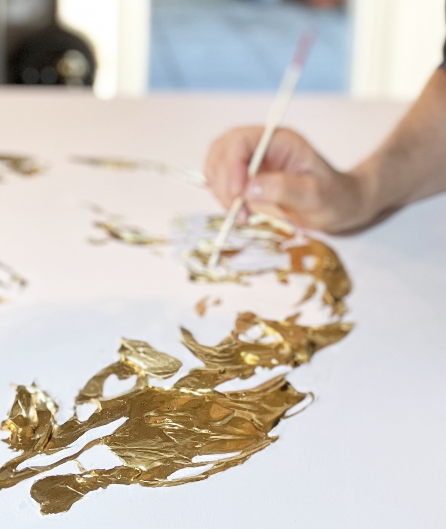 Emanuela Hauth creating an original Auric Art piece with gold.
