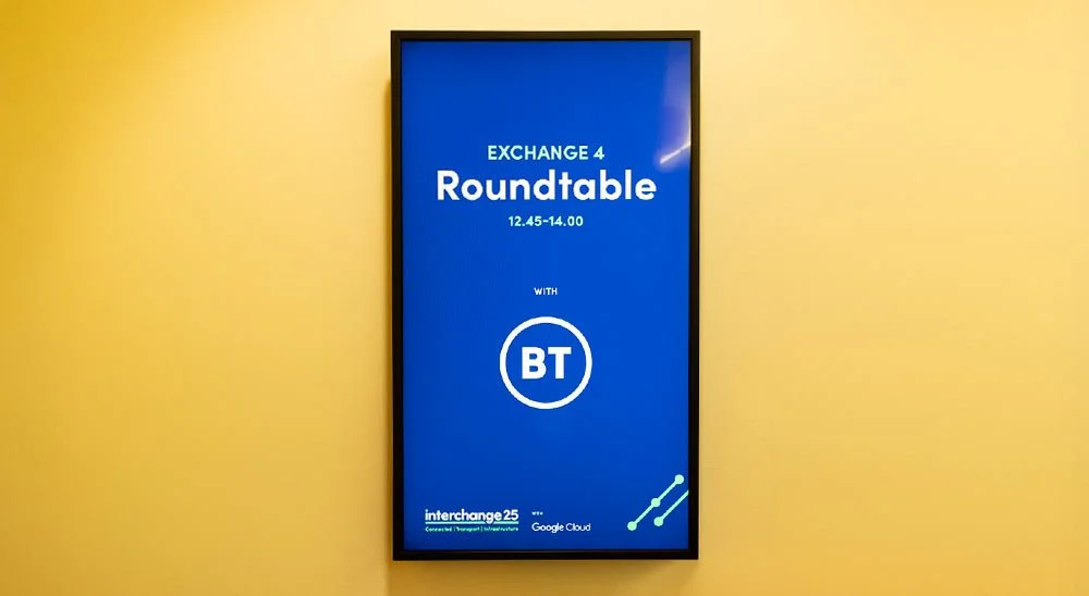 Digital display announcing a roundtable event with BT from 12:45 to 14:00, sponsored by Google Cloud, at interchange25 conference.