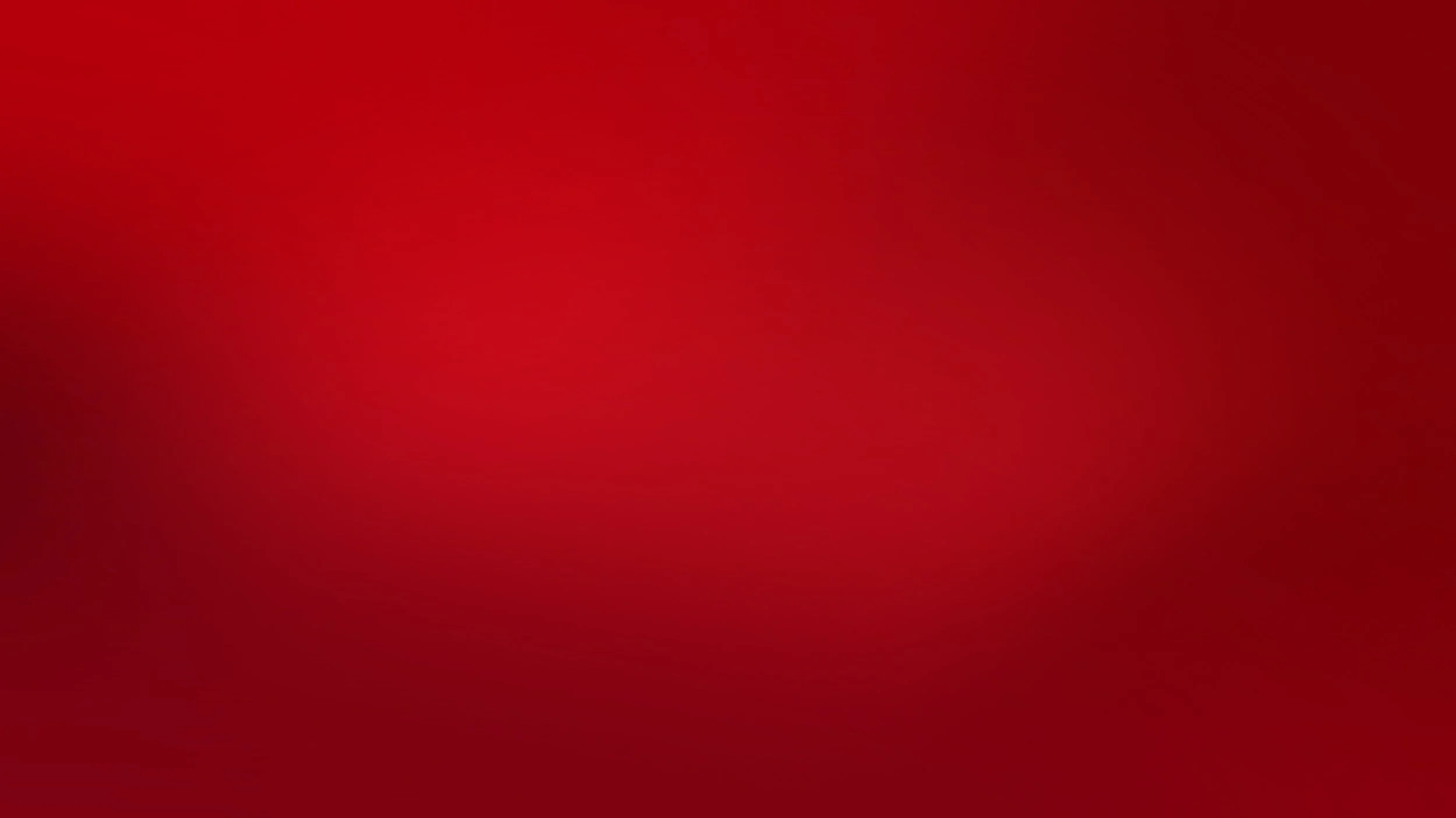 A solid red textured background with a gradient effect.
