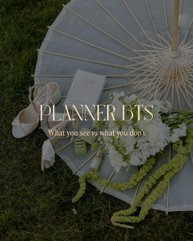 A white parasol, a pair of white high heels, a small book, a green perfume bottle, a small white bottle, a white flower arrangement, a notebook, and some greenery are arranged on grass. Text overlay says "PLANNER BTS" and "What you see vs what you don’t."