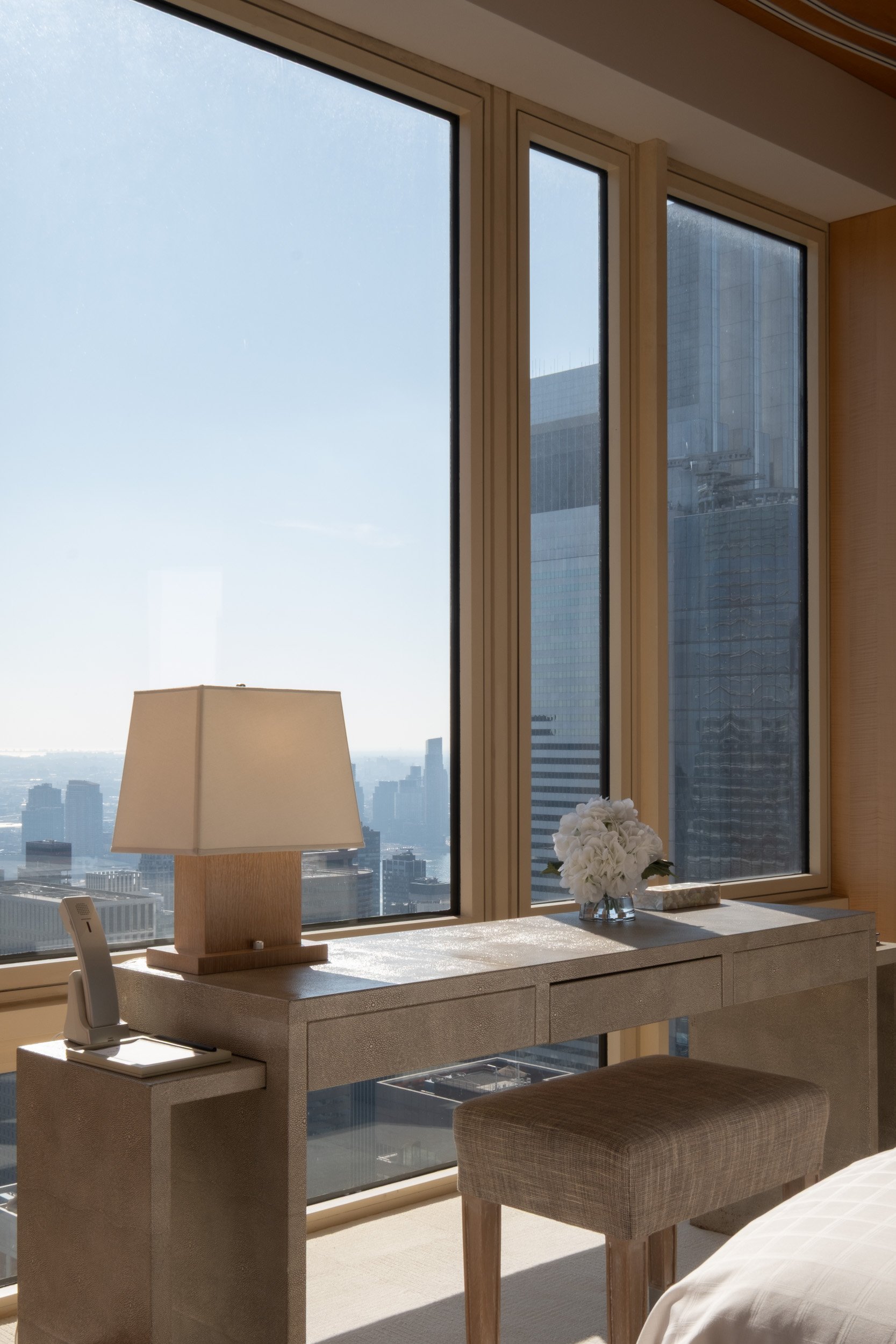Suite interior desk with city views at Four Seasons Hotel New York