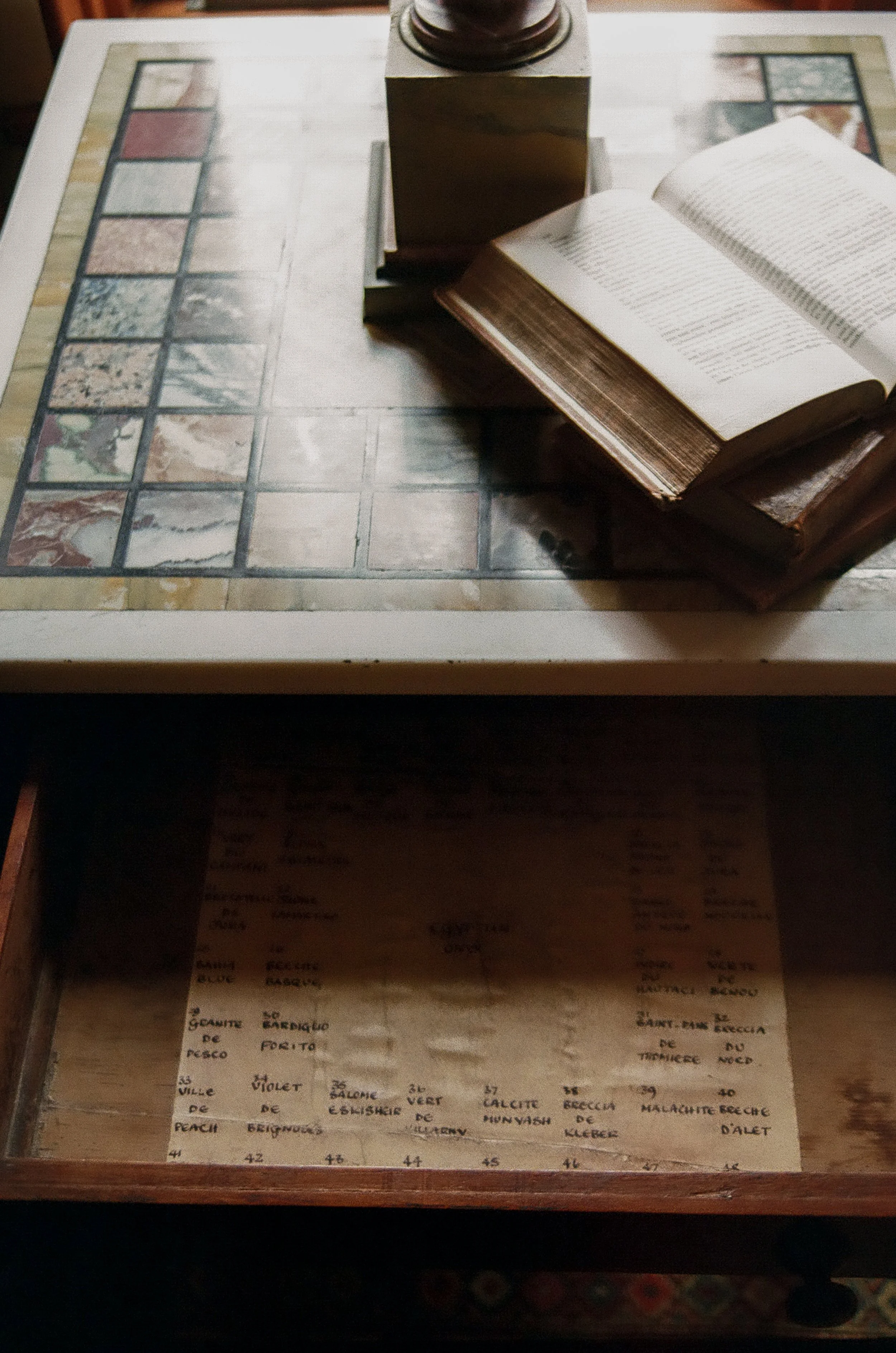 An open book and desk drawer at Lee Stanton Laguna Beach home