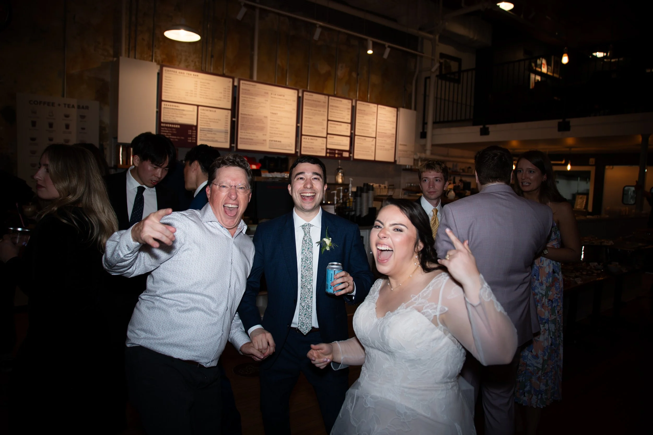 groom and bride having incredible time with her dad at Blackberry Argenta Market