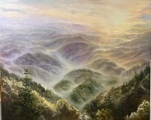 A painting of a mountain landscape with fog rolling through green valleys and trees, under a sky with warm colors.