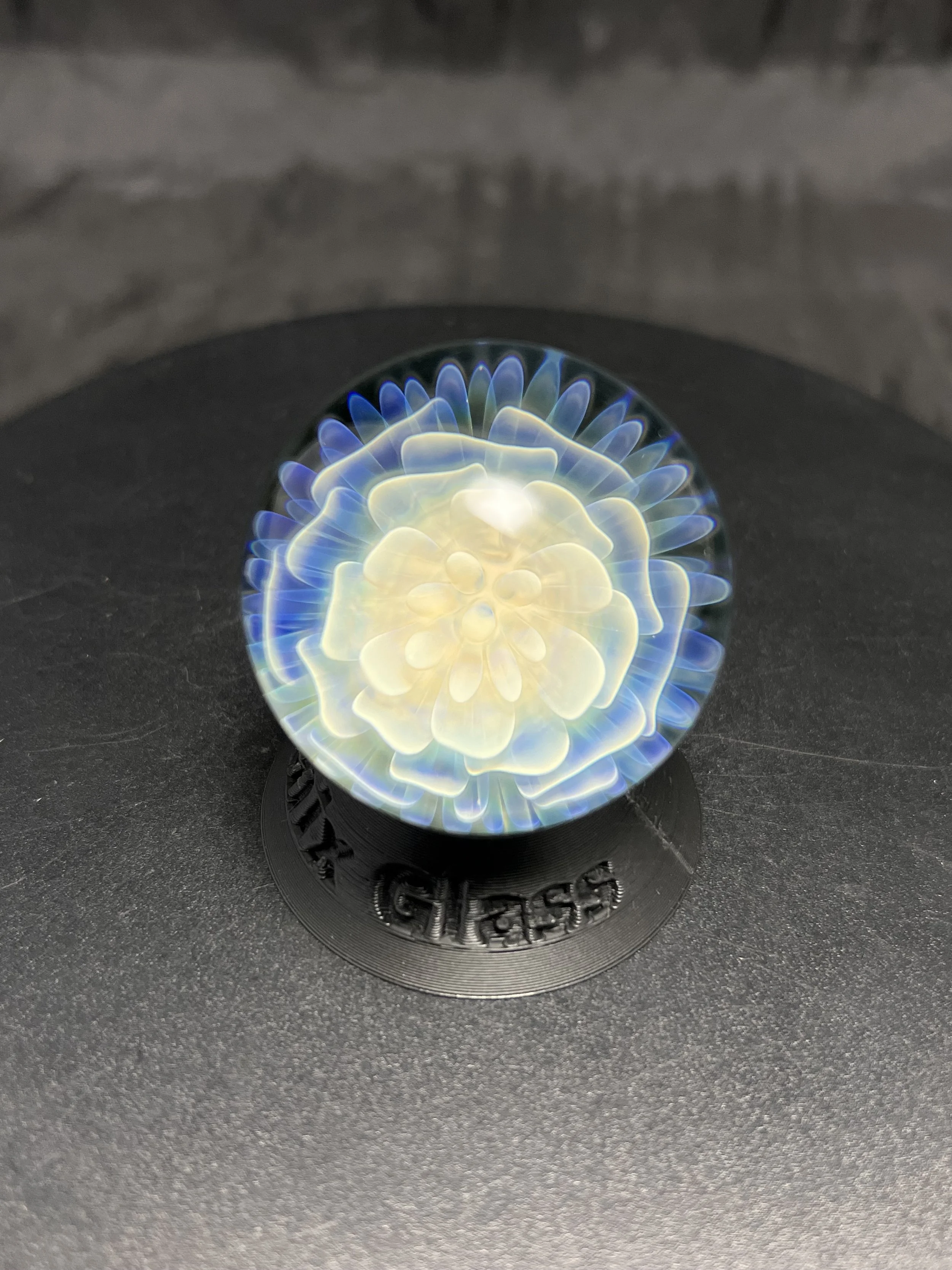 Beautiful blue holographic like silver fumed glass flower marble. Fumed Glass. Ponder the orb.