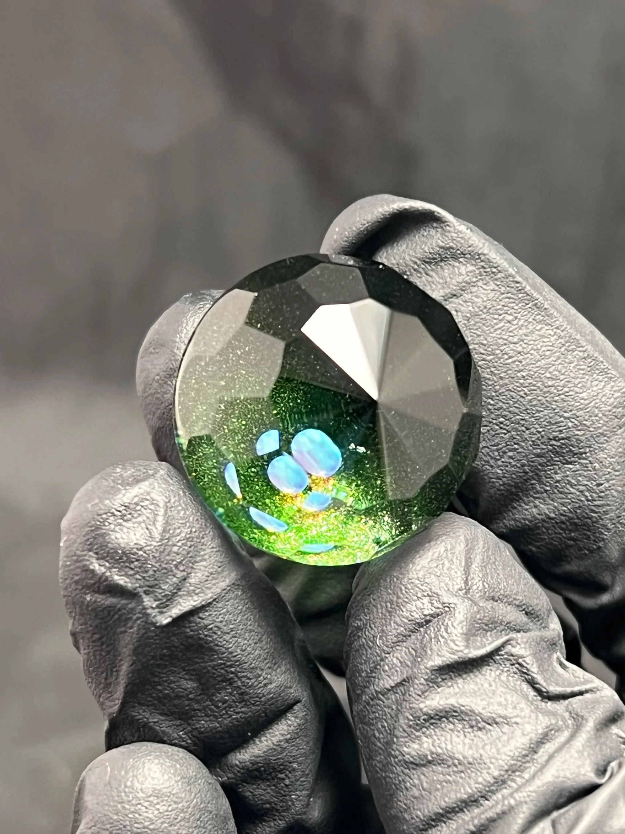 Heavy green Xenon Glass Marble Faceted 25mm