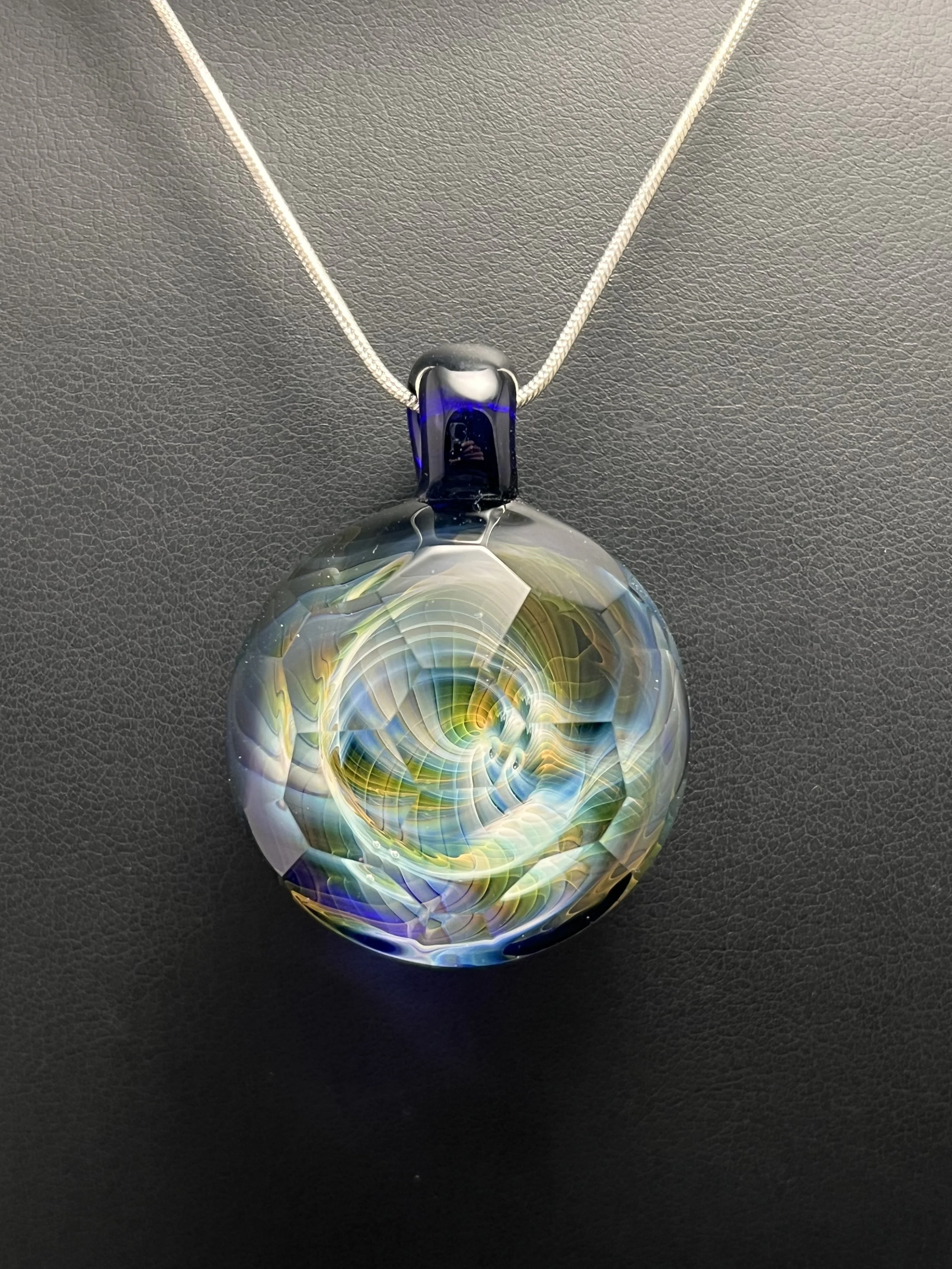 Handmade faceted silver and gold fumed glass pendant on cobalt blue