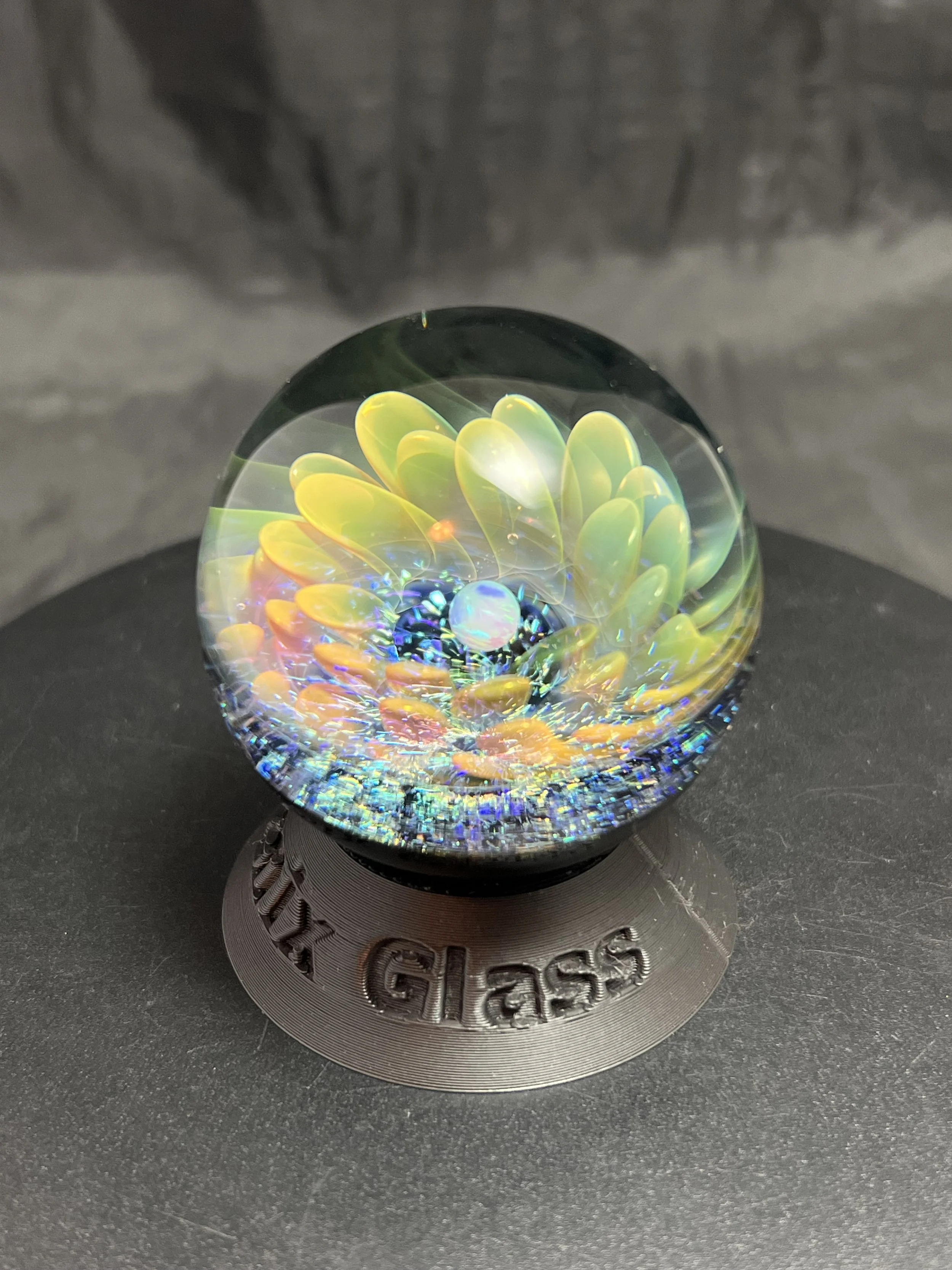 Holographic like silver and gold fumed glass flower with opal sphere and rainbow dichroic glass. liquid phoenix glass. Jodi Sayles