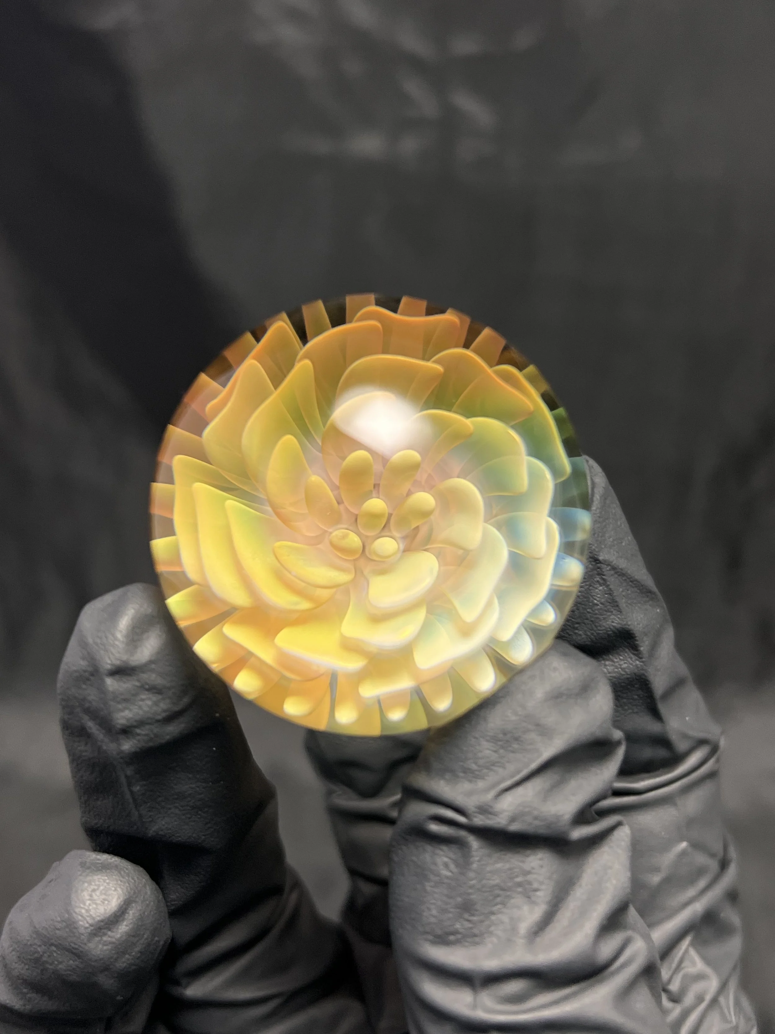 Ponder the orb with this gold fumed golden flower borosilicate glass art marble.
