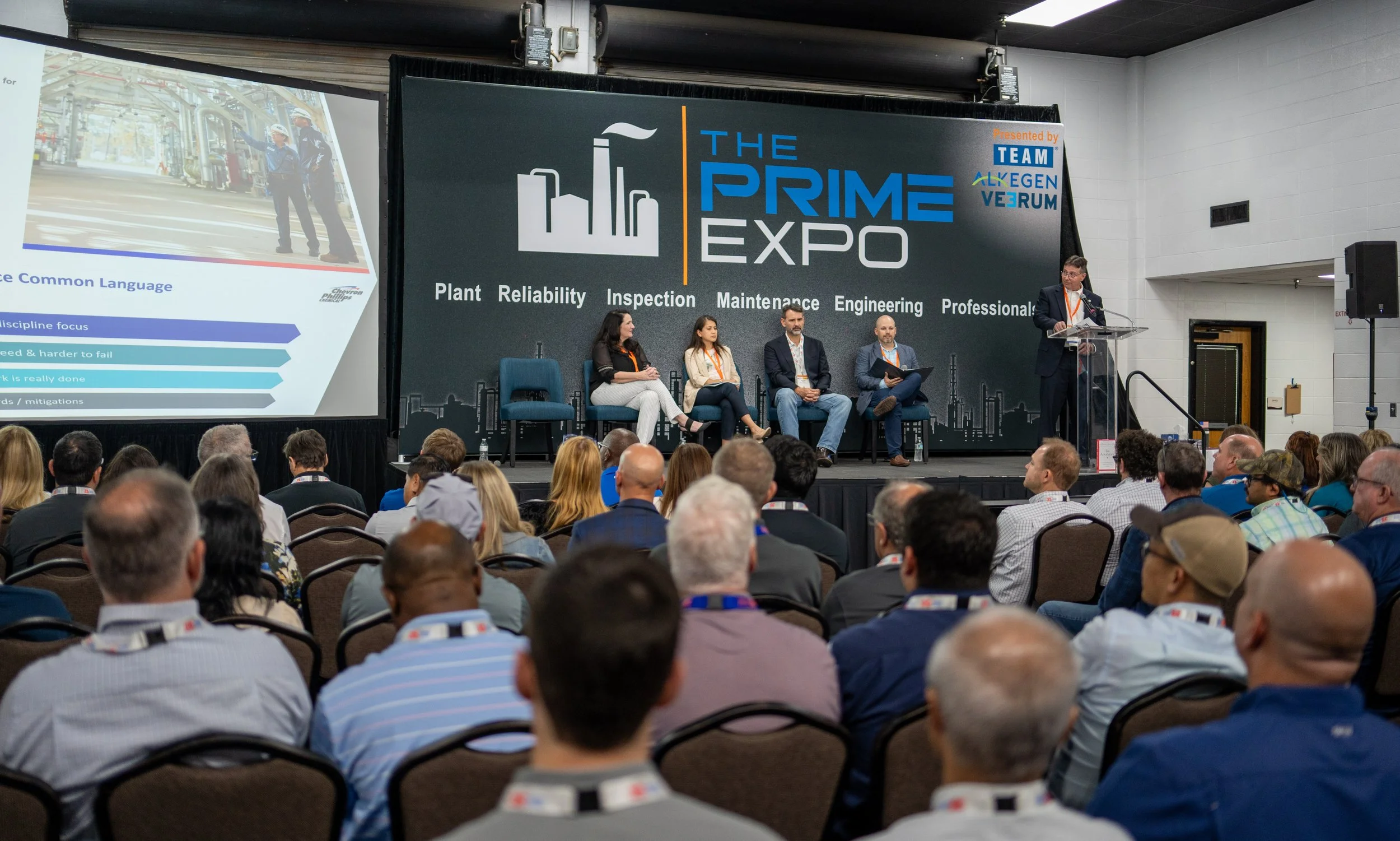 Conference event at The Prime Expo with panel discussion and audience in attendance.
