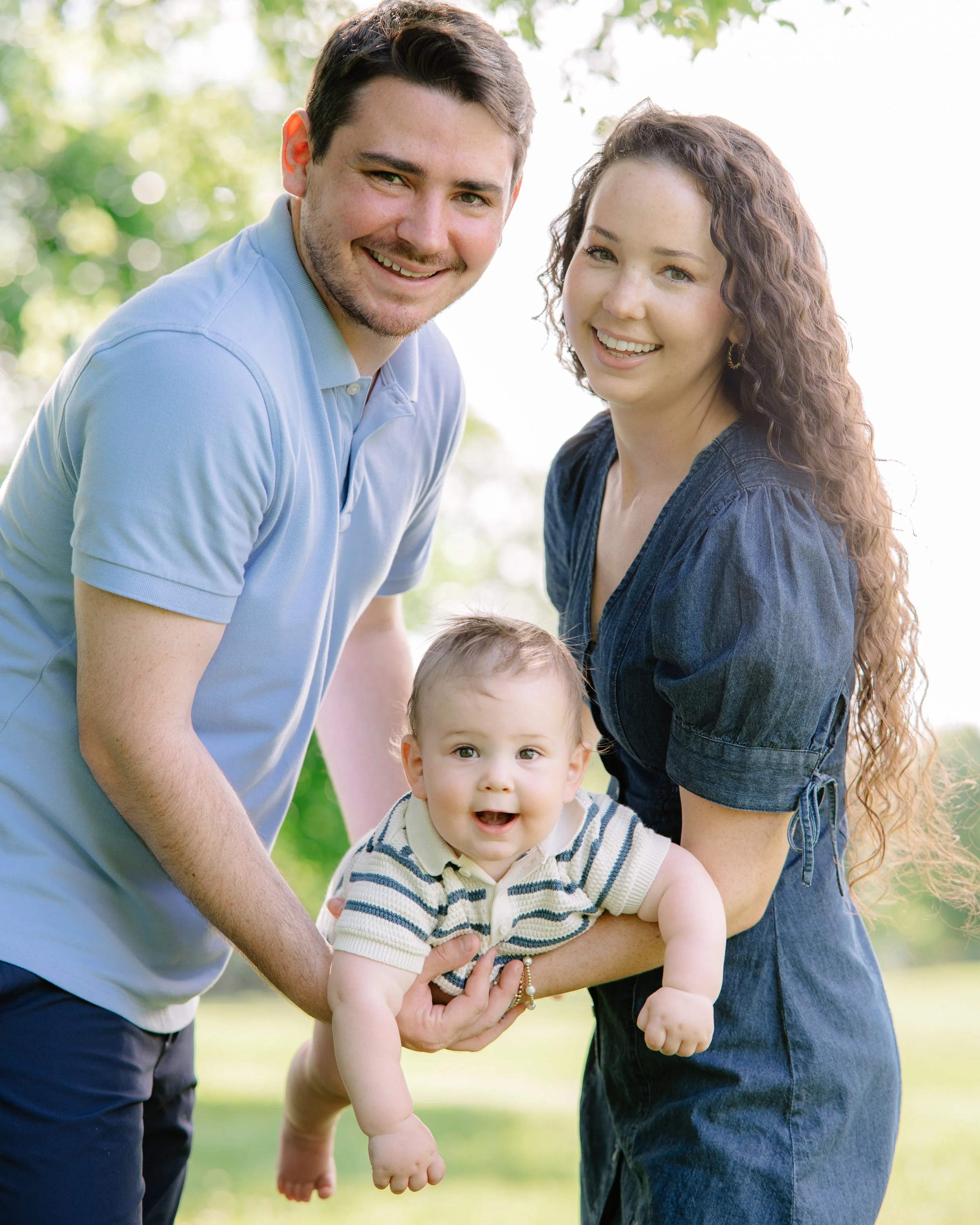 Outdoor family portraits with genuine smiles and candid moments in Knoxville tn