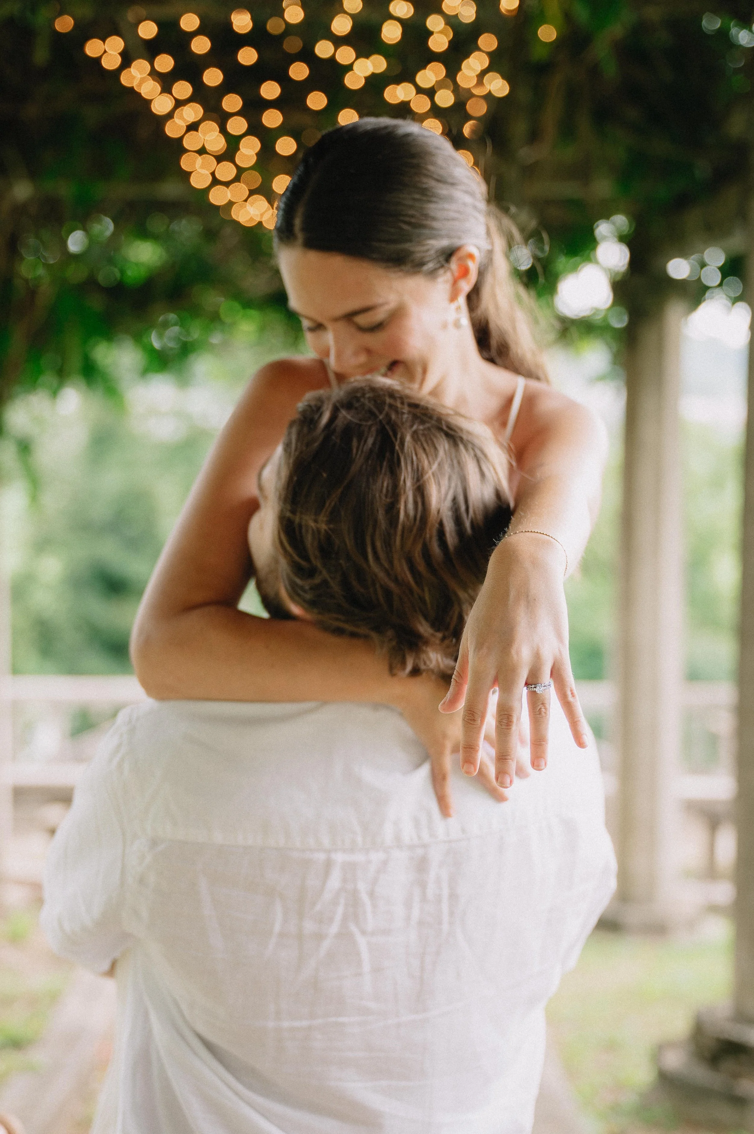 Engaged couple posing outside Bleak House during their Knoxville engagement session