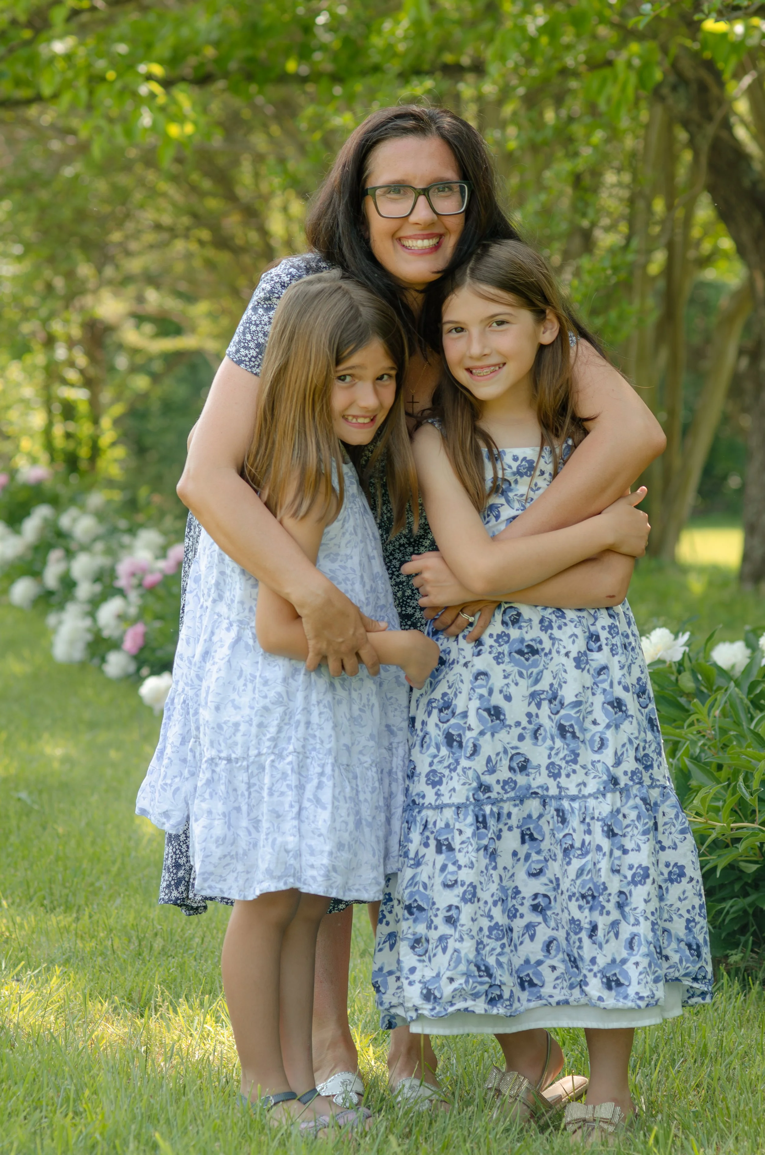Mom and daughters photoshoot in Knoxville flower field with natural light and gentle tones