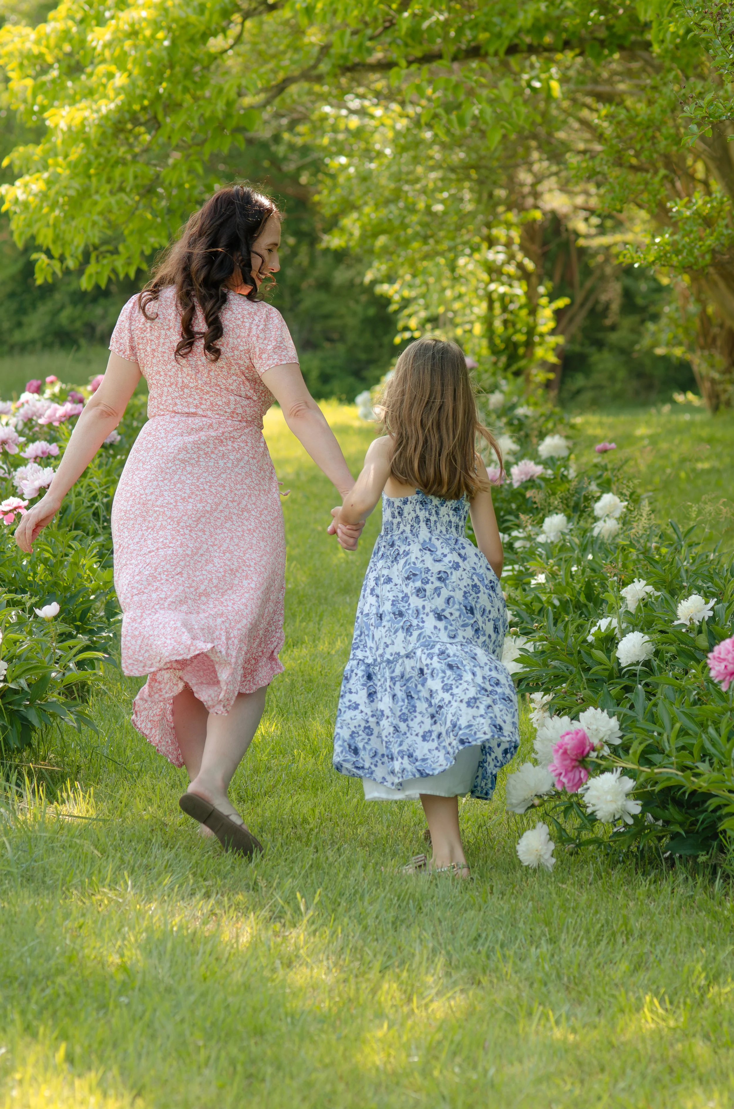 Playful mommy and me session in Knoxville with young children in outdoor setting