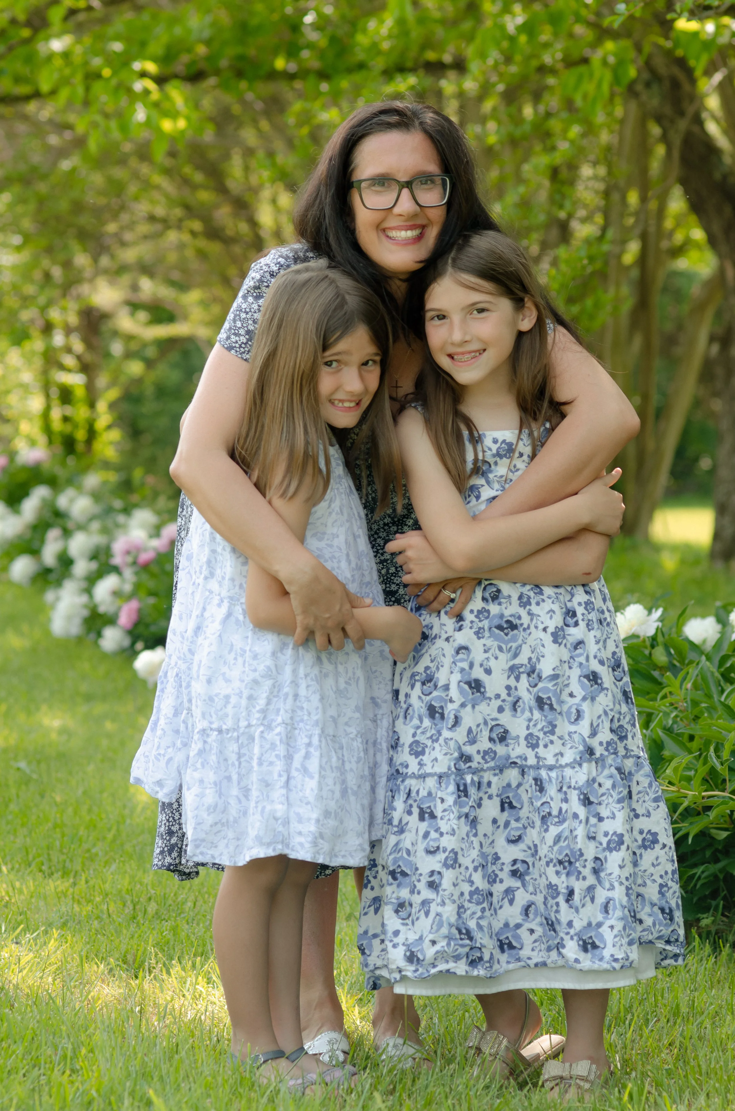 Mom and daughters photoshoot in Knoxville flower field with natural light and gentle tones